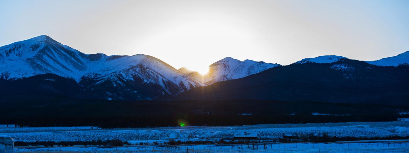 The sun sets over Coloradoâs highest mountain, 14,400-foot Mt. Elbert, left, Tuesday, Dec. 5, 2017, near Leadville, Colo. Elbert is part of the Sawatch Range. (The Gazette, Christian Murdock) (copy)
