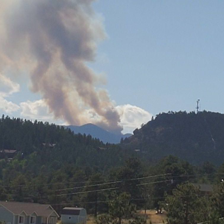 Wildfire sparks on mountain peak in Colorado