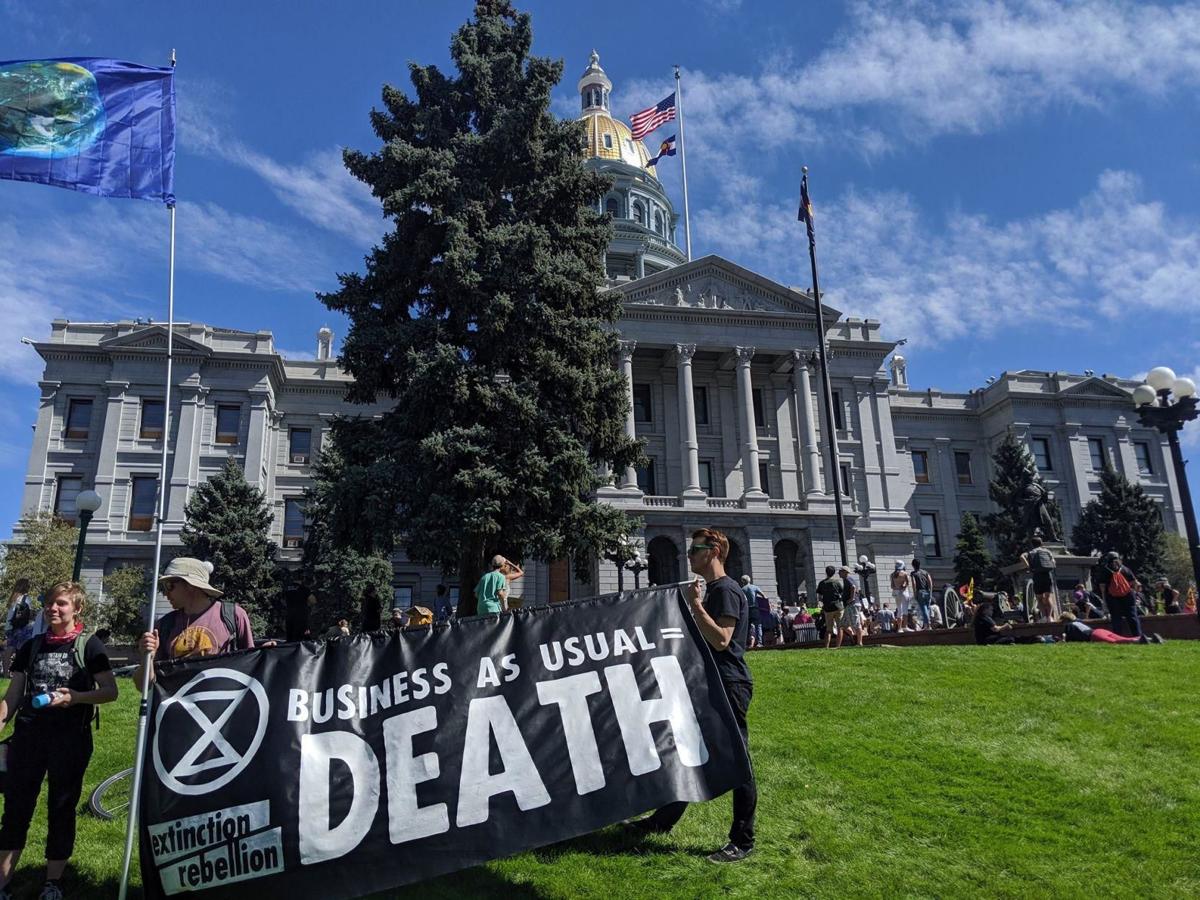 Denver protesters arrested for blocking traffic during climate change demonstration