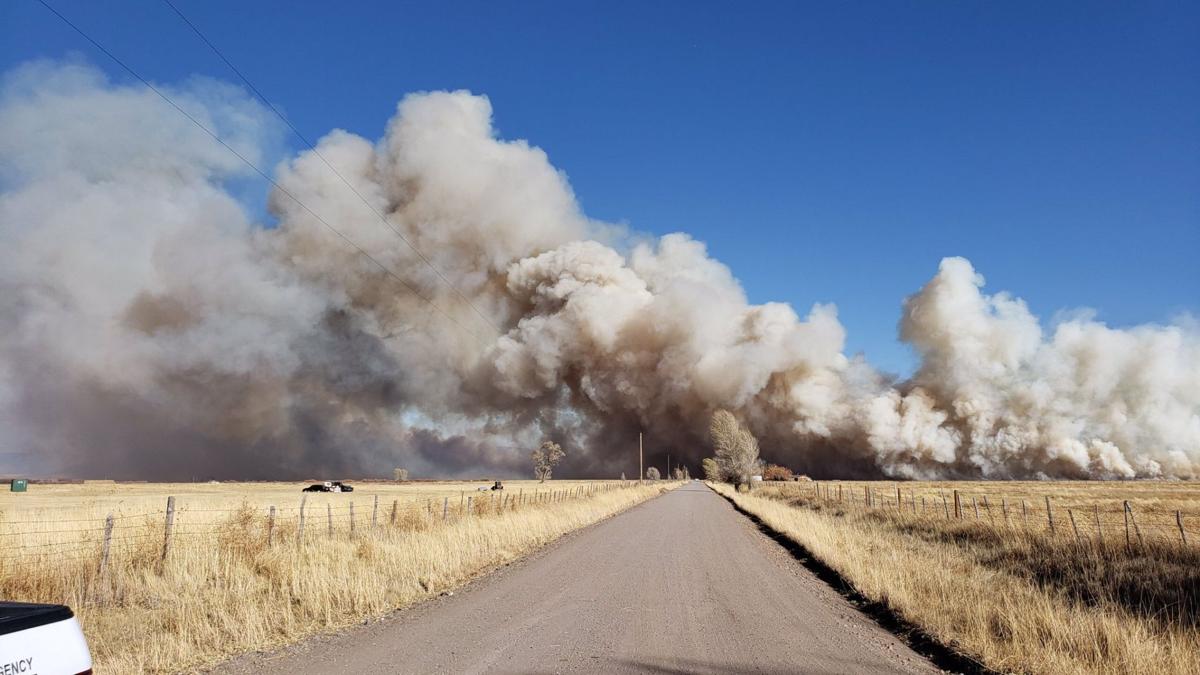 Wildfire destroys building, forces evacuations in Colorado