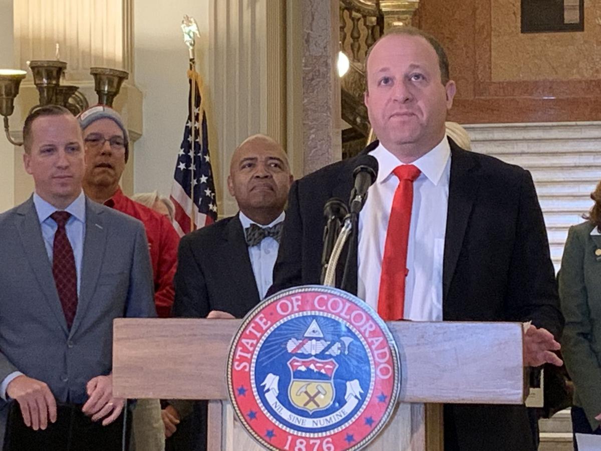 Polis commutes 8 sentences, including for fraud that victimized governor