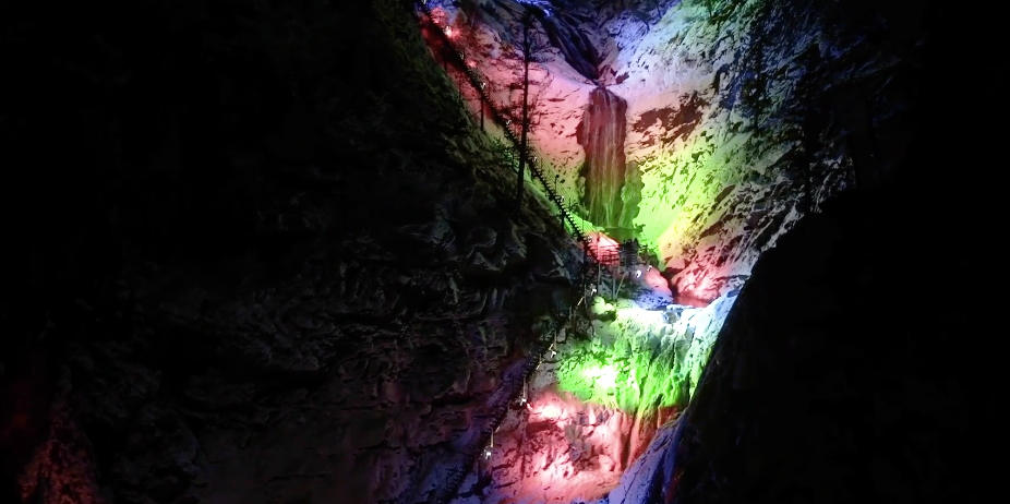 Colorado waterfall illuminated with multi-colored winter lights