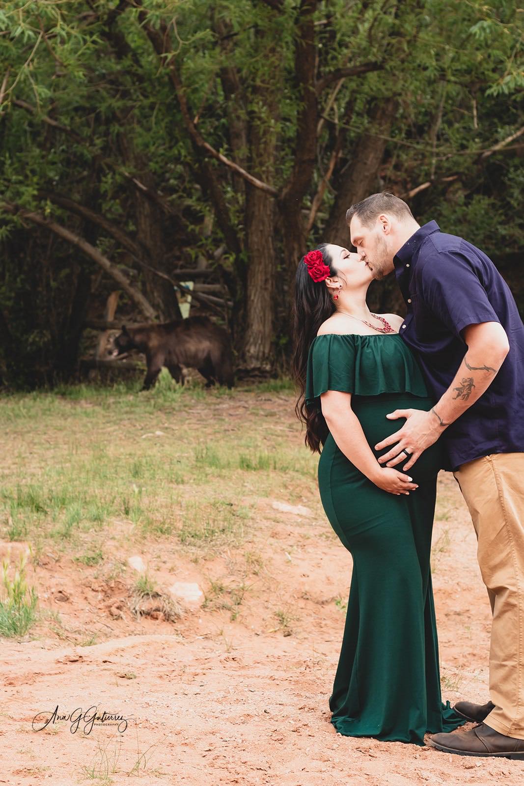 A black bear unexpectedly dropped in on a couple’s maternity photoshoot in Colorado Springs. Photo Credit: Ana G. Gutierrez Photography.