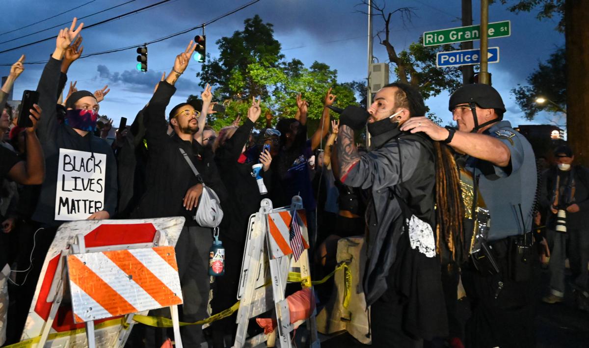 For the third night, after protesting most of the day at City Hall and Acacia Park, the crowd marched to the Police Operations Center. Sgt Olav Chaney and one of the protesters addressed the crowd. After Chaney spoke to the crowd, answering their questions and listening to their grievances, the crowd left peacefully and marched back up Nevada Ave. on Monday, June 1, 2020. Photo Credit: Jerilee Bennett, The Gazette