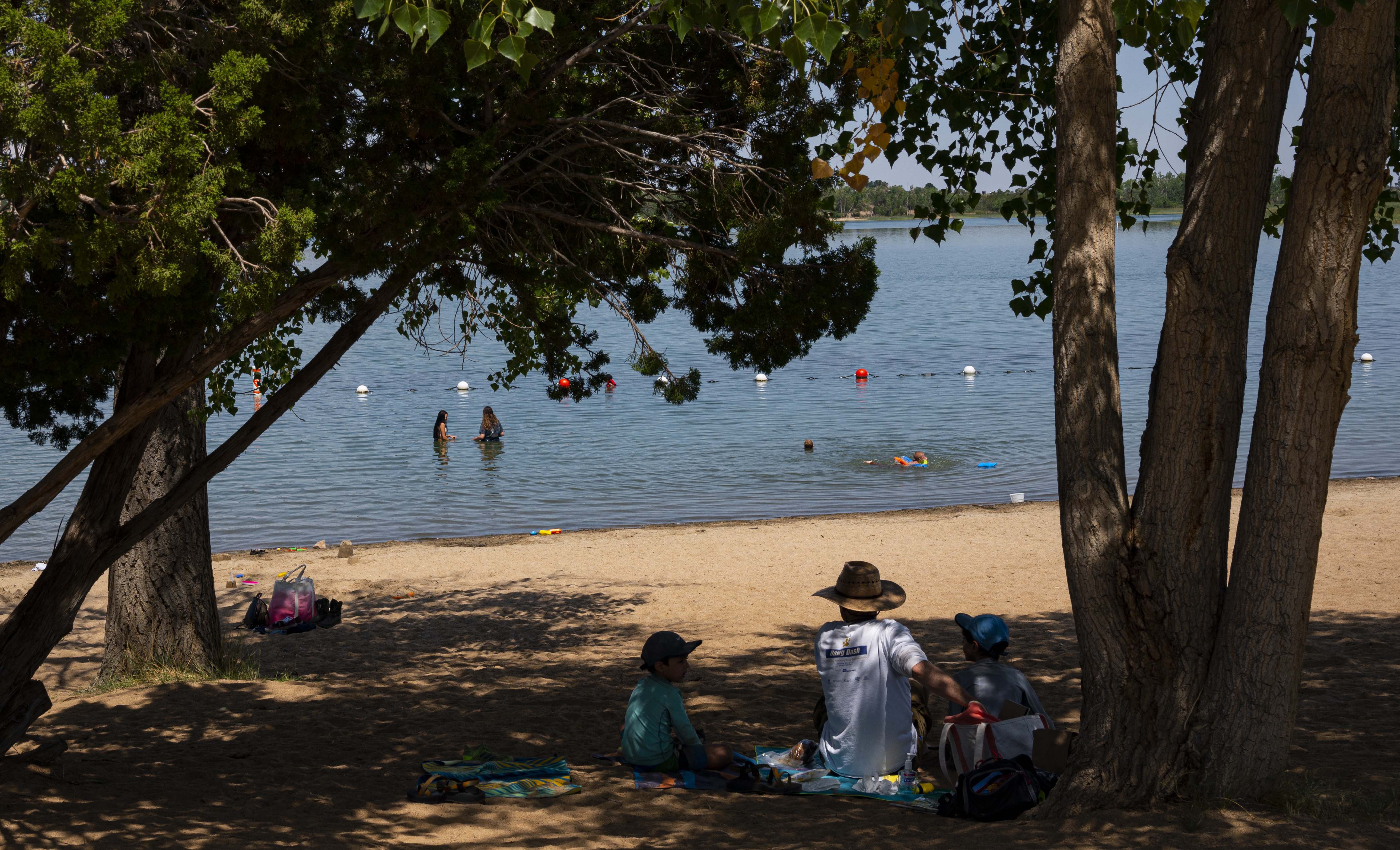Visitors enjoy the shade and the swimming area at Martin Lake in Lathrop State Park on a hot summer day. (Christian Murdock/The Gazette)