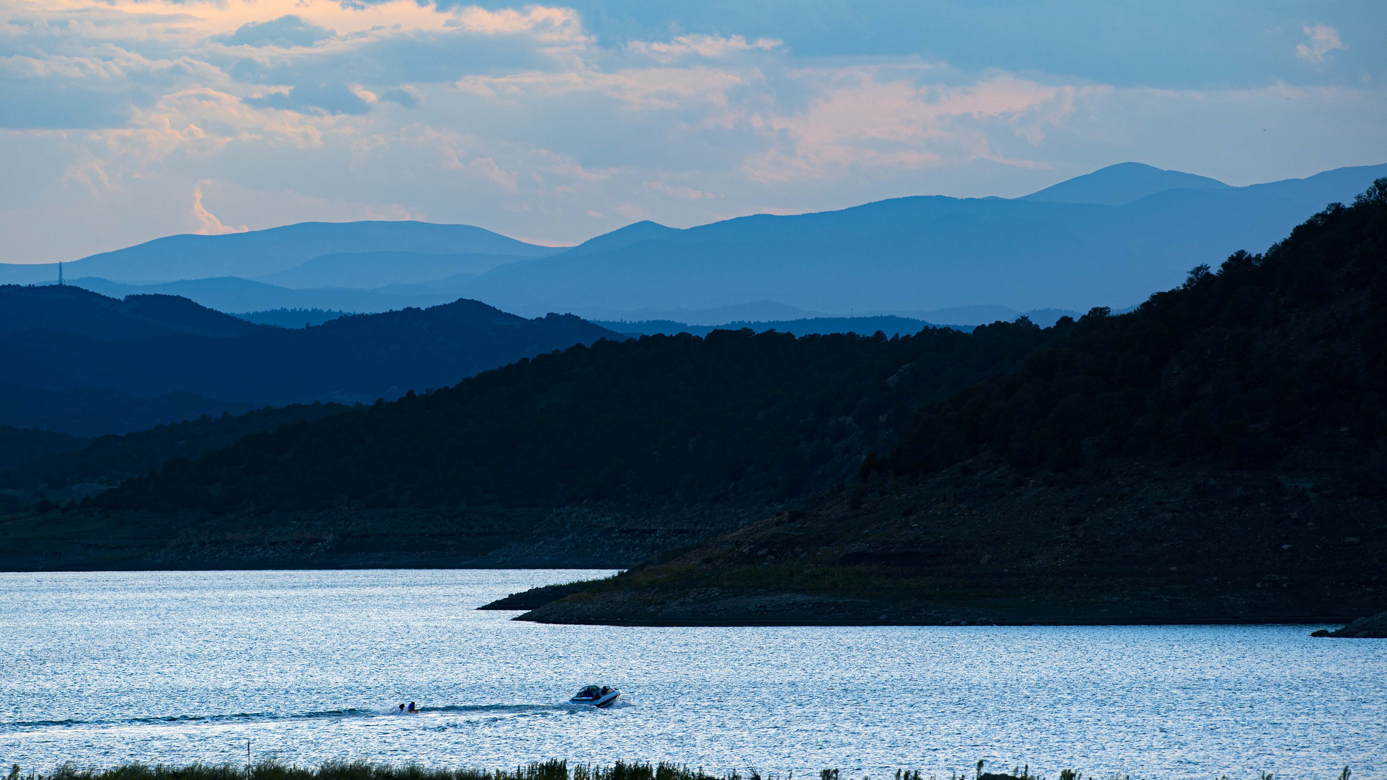 A motorboat pulls a person in a tube as the sun sets over Trinidad Lake in this 2020 photo. (Christian Murdock, The Gazette)