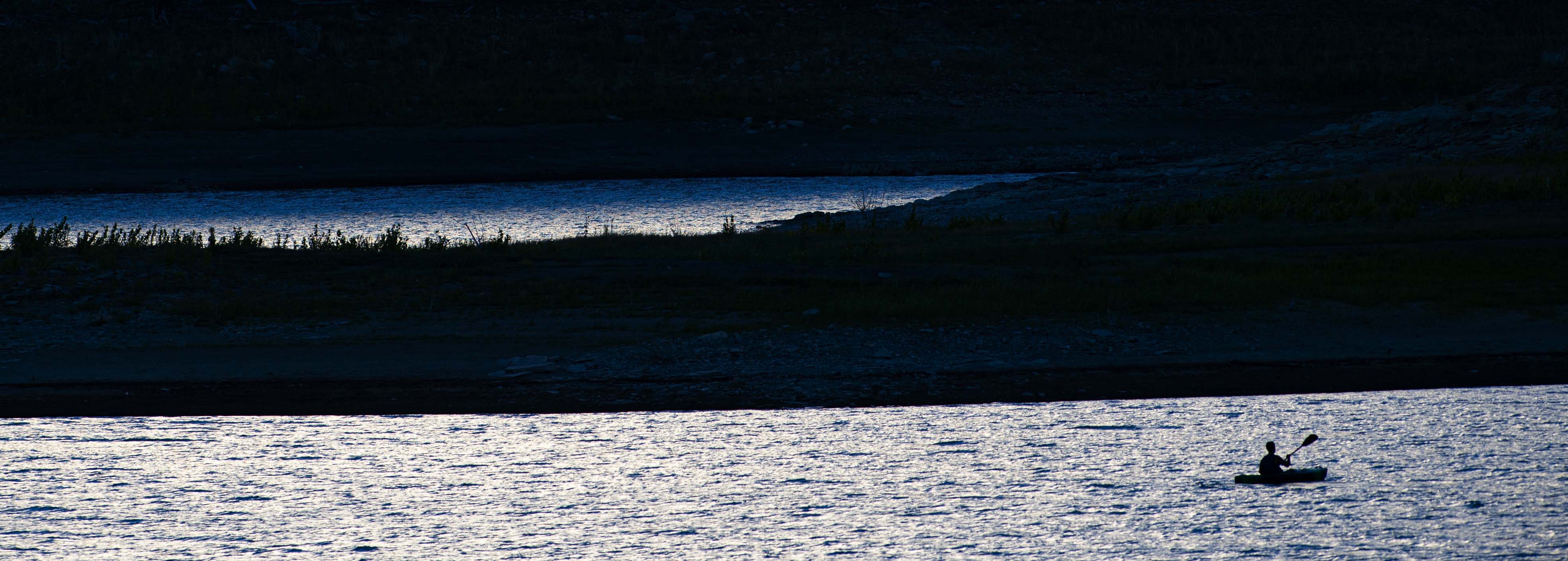 A kayaker explores Trinidad Lake Monday, Aug. 17, 2020, as day turns to night at Trinidad Lake State Park in southern Colorado. (The Gazette, Christian Murdock) (Christian Murdock/The Gazette)