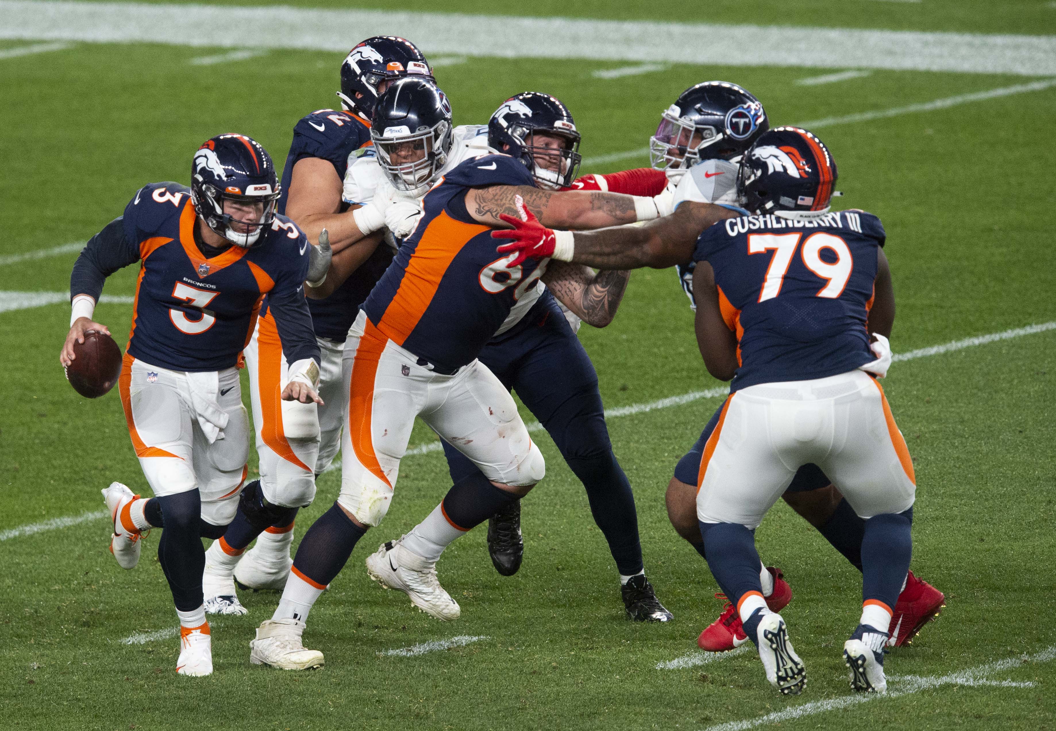 Denver Broncos quarterback Drew Lock (3) looks for an open receiver against the Tennessee Titans late in the fourth quarter Monday, Sept. 14, 2020, at Empower Field at Mile High in Denver.The Titans won 16-14. (The Gazette, Christian Murdock) (Christian Murdock/The Gazette)