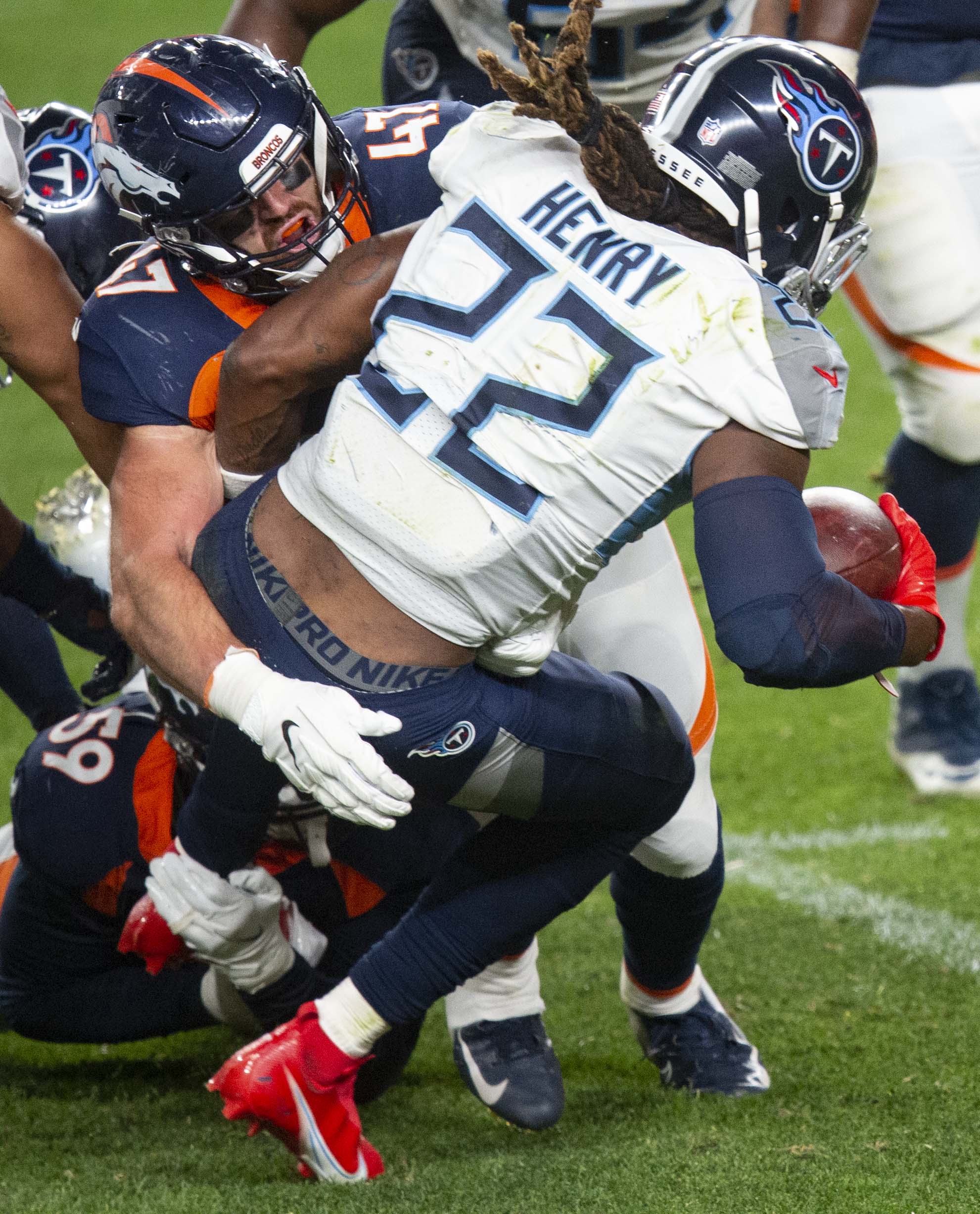 Denver Broncos inside linebacker Josey Jewell (47) brings down Tennessee Titans running back Derrick Henry (22) during the third quarter Monday, Sept. 14, 2020, at Empower Field at Mile High in Denver.The Titans won 16-14. (The Gazette, Christian Murdock) (Christian Murdock/The Gazette)