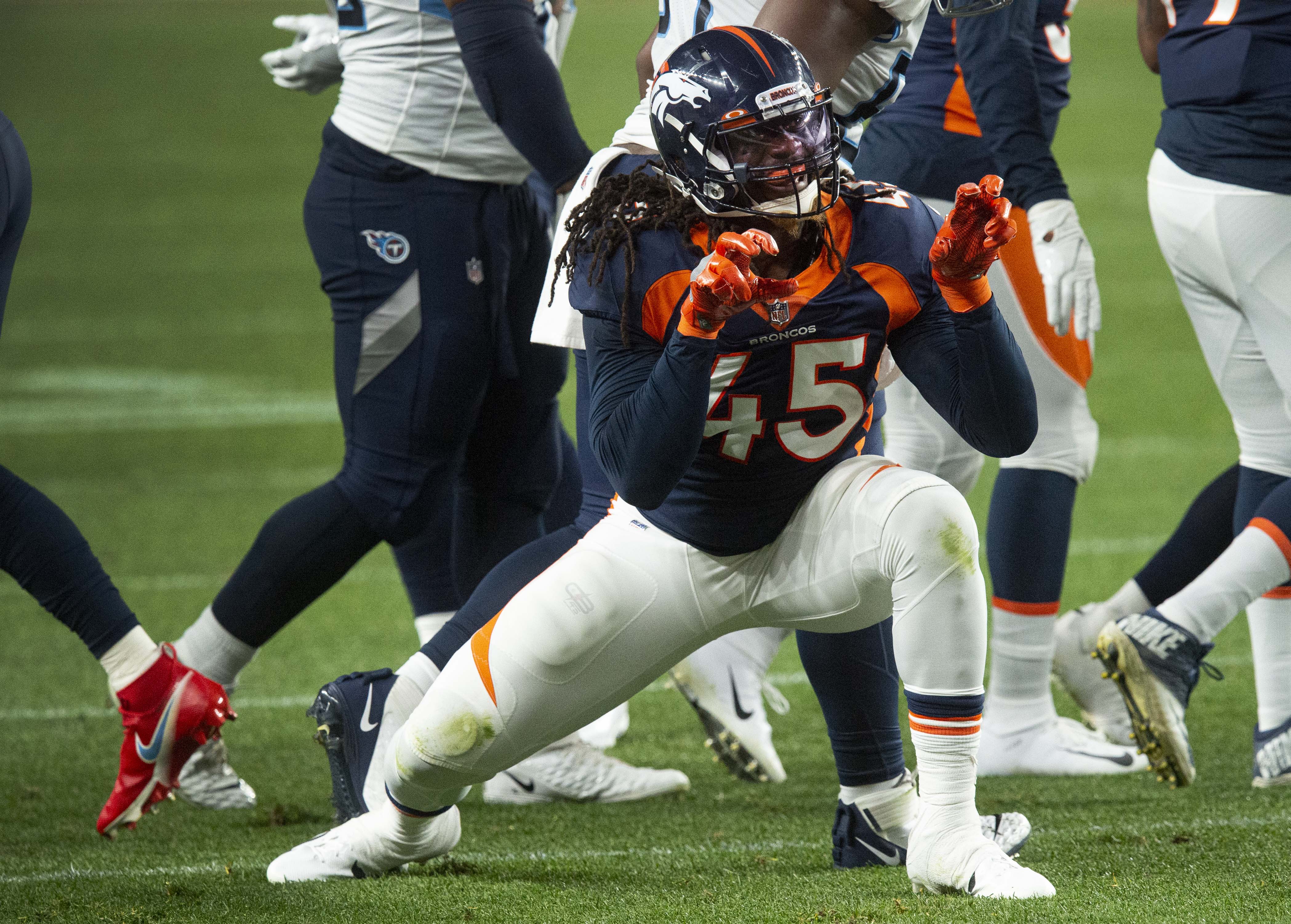 Denver Broncos linebacker A.J. Johnson (45) celebrates after stopping Tennessee Titans running back Derrick Henry (22) for a short gain during the second quarter Monday, Sept. 14, 2020, at Empower Field at Mile High in Denver. (The Gazette, Christian Murdock) (Christian Murdock/The Gazette)