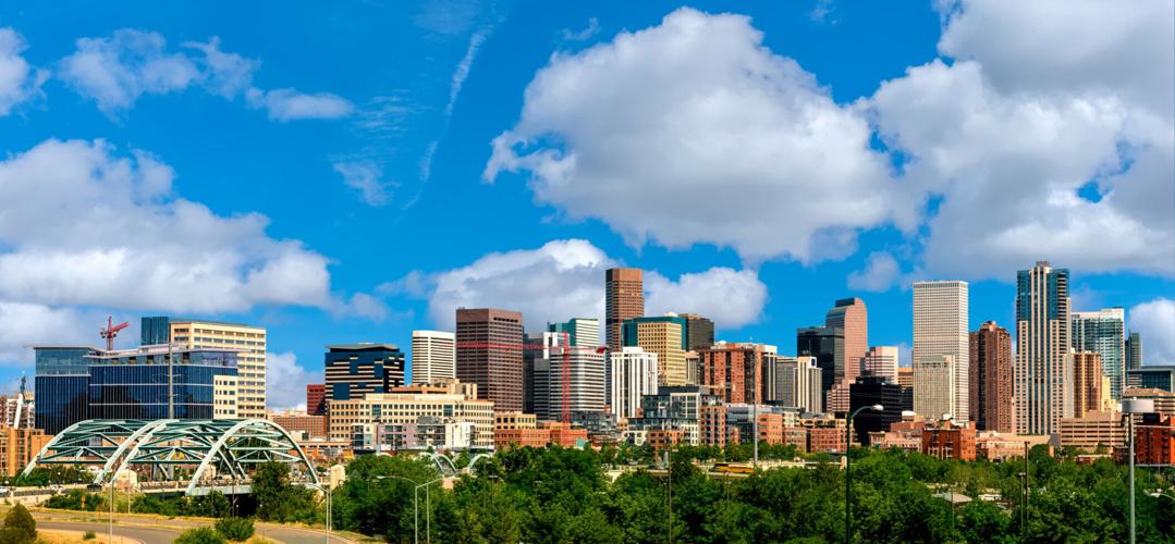 Colorful skyline of Denver Colorado with clouds in the sky