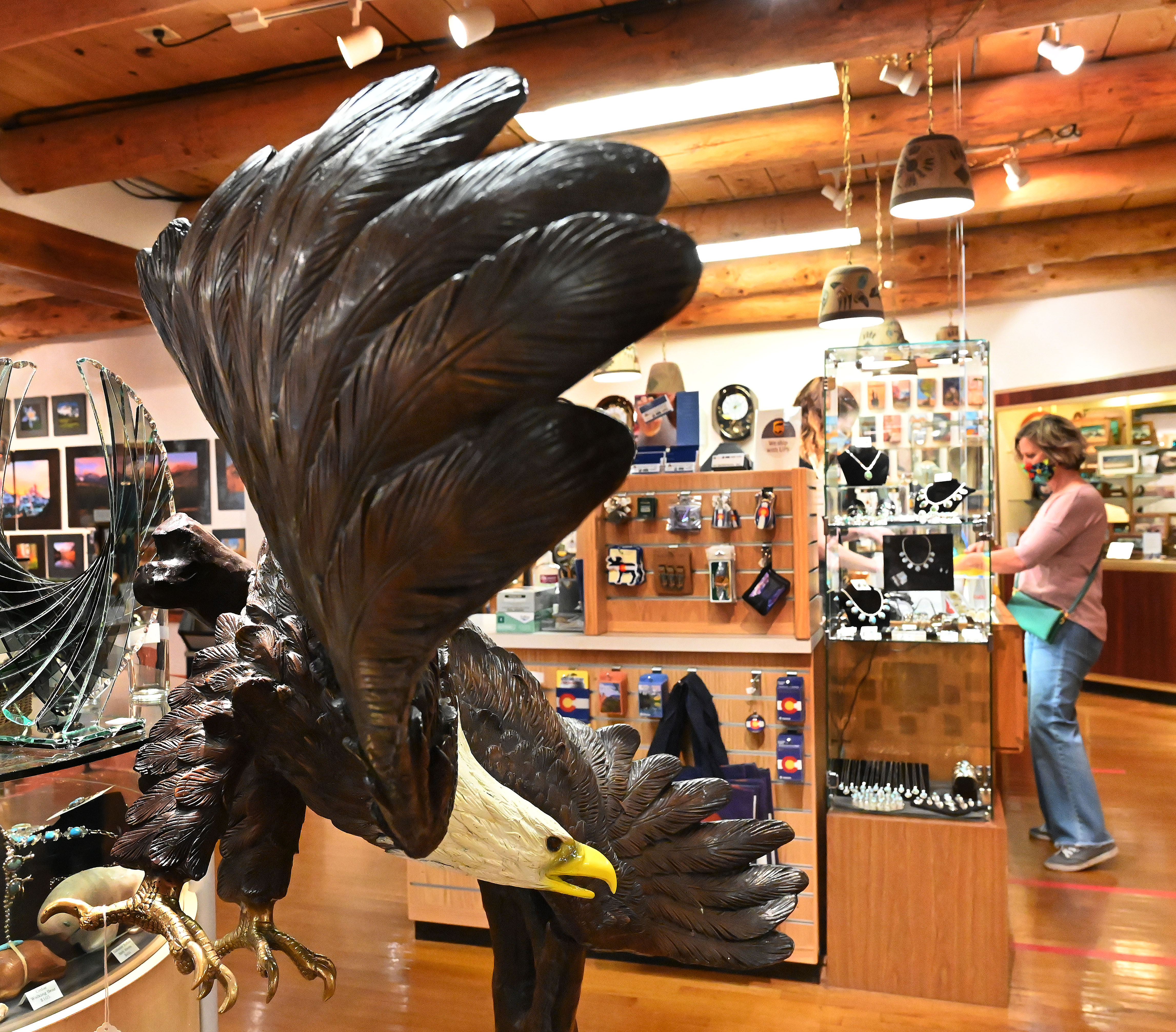 A customer shops at the Garden the Gods Trading Post. Tim Haas, CEO of TAT Enterprises, which owns the post and seven other shops in Old Colorado City and Manitou Springs that cater to tourists, said sales volumes have improved each month since May. (JERILEE BENNETT, THE GAZETTE)