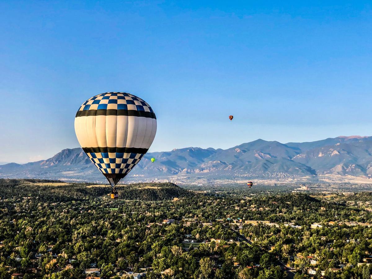 A balloon drifts high above Colorado Springs during the 2020 Labor Day Lift Off Festival. Photo Credit: Spencer McKee.