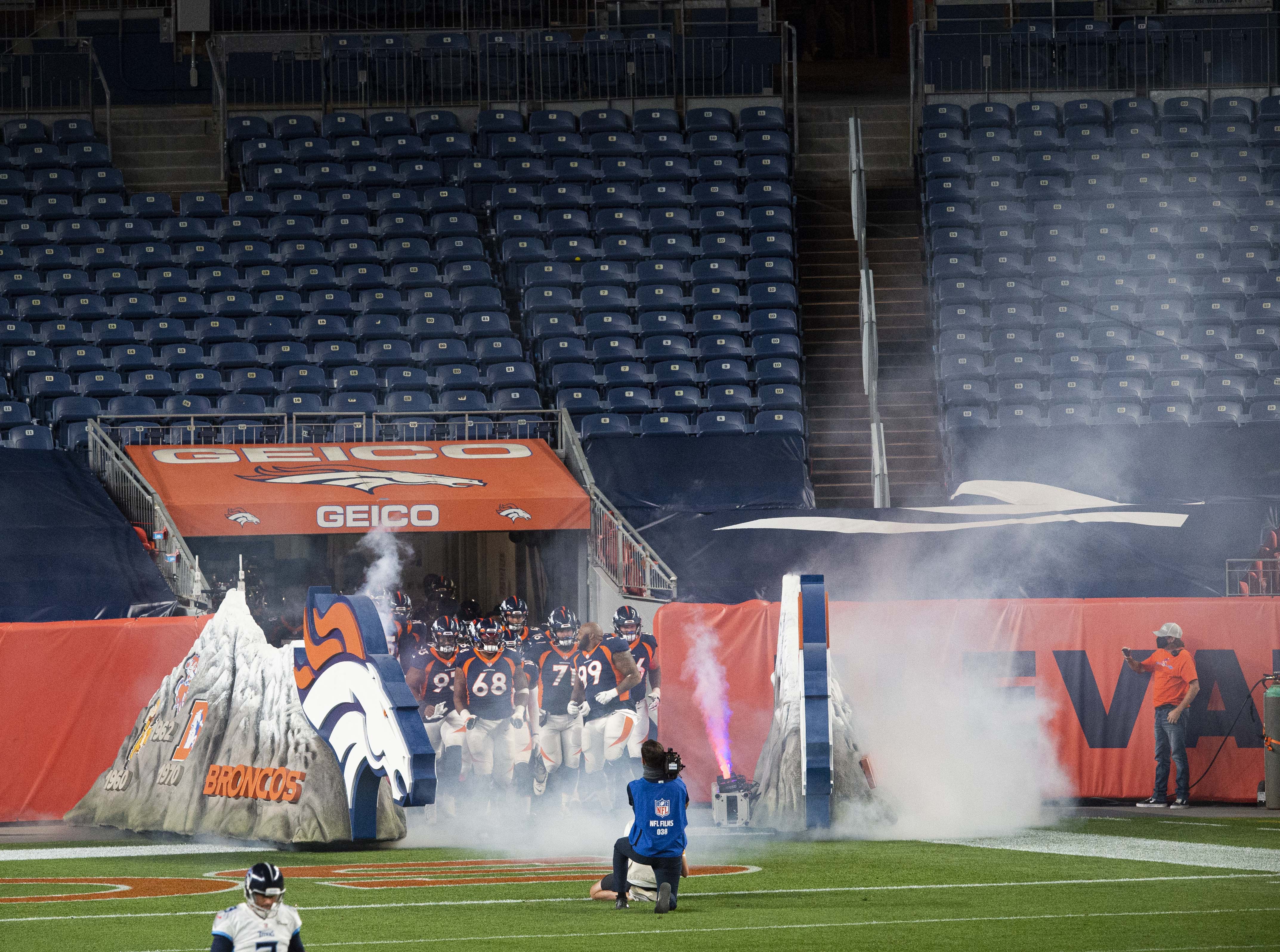 The Denver Broncos run into an empty stadium for the start of their game against the Tennessee Titans Monday, Sept. 14, 2020, at Empower Field at Mile High in Denver. (The Gazette, Christian Murdock) (Christian Murdock/The Gazette)