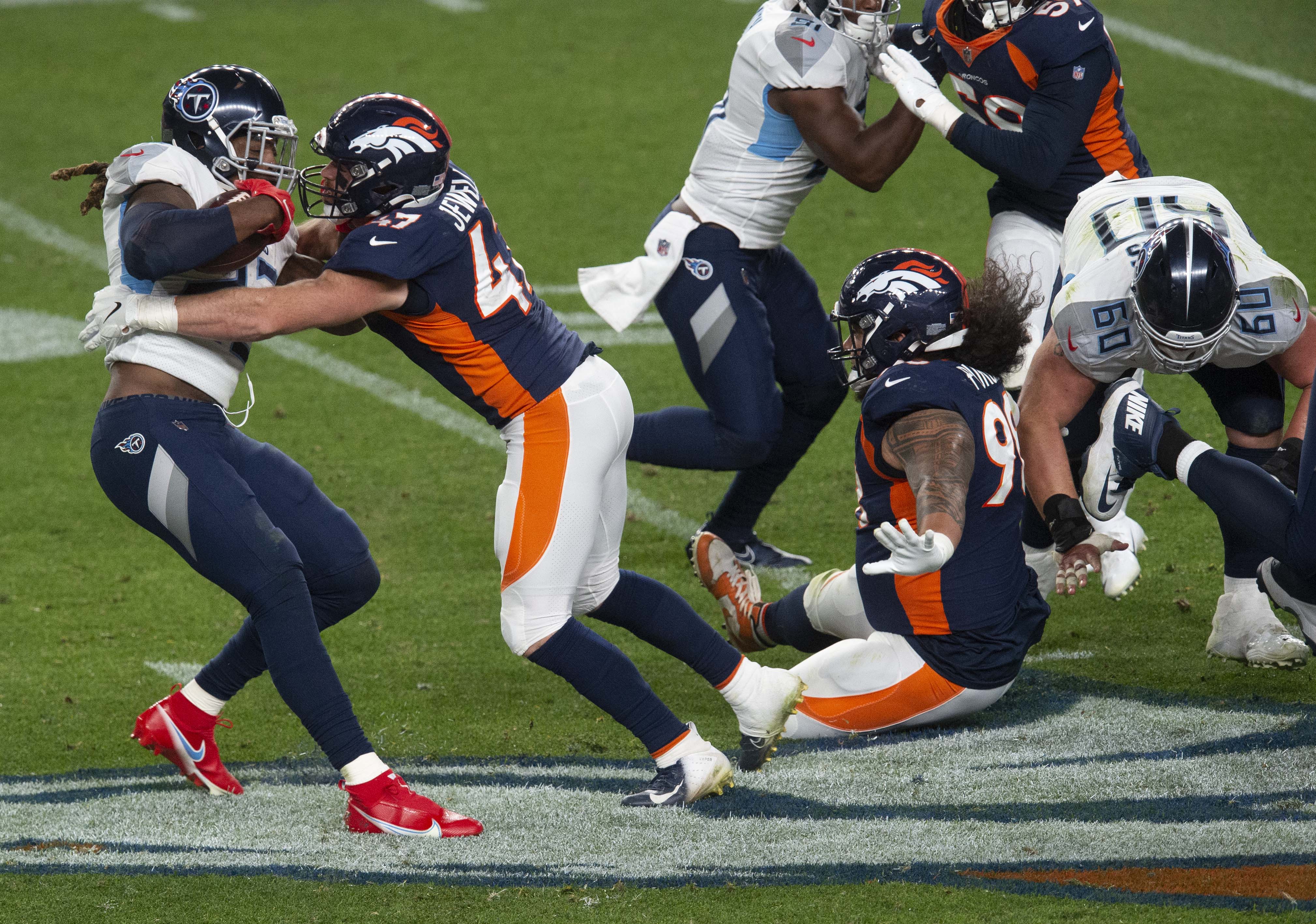 Denver Broncos inside linebacker Josey Jewell (47) tackles Tennessee Titans running back Derrick Henry (22) behind the line of scrimmage for a 2-yard loss during the third quarter Monday, Sept. 14, 2020, at Empower Field at Mile High in Denver.The Titans won 16-14. (The Gazette, Christian Murdock) (Christian Murdock/The Gazette)