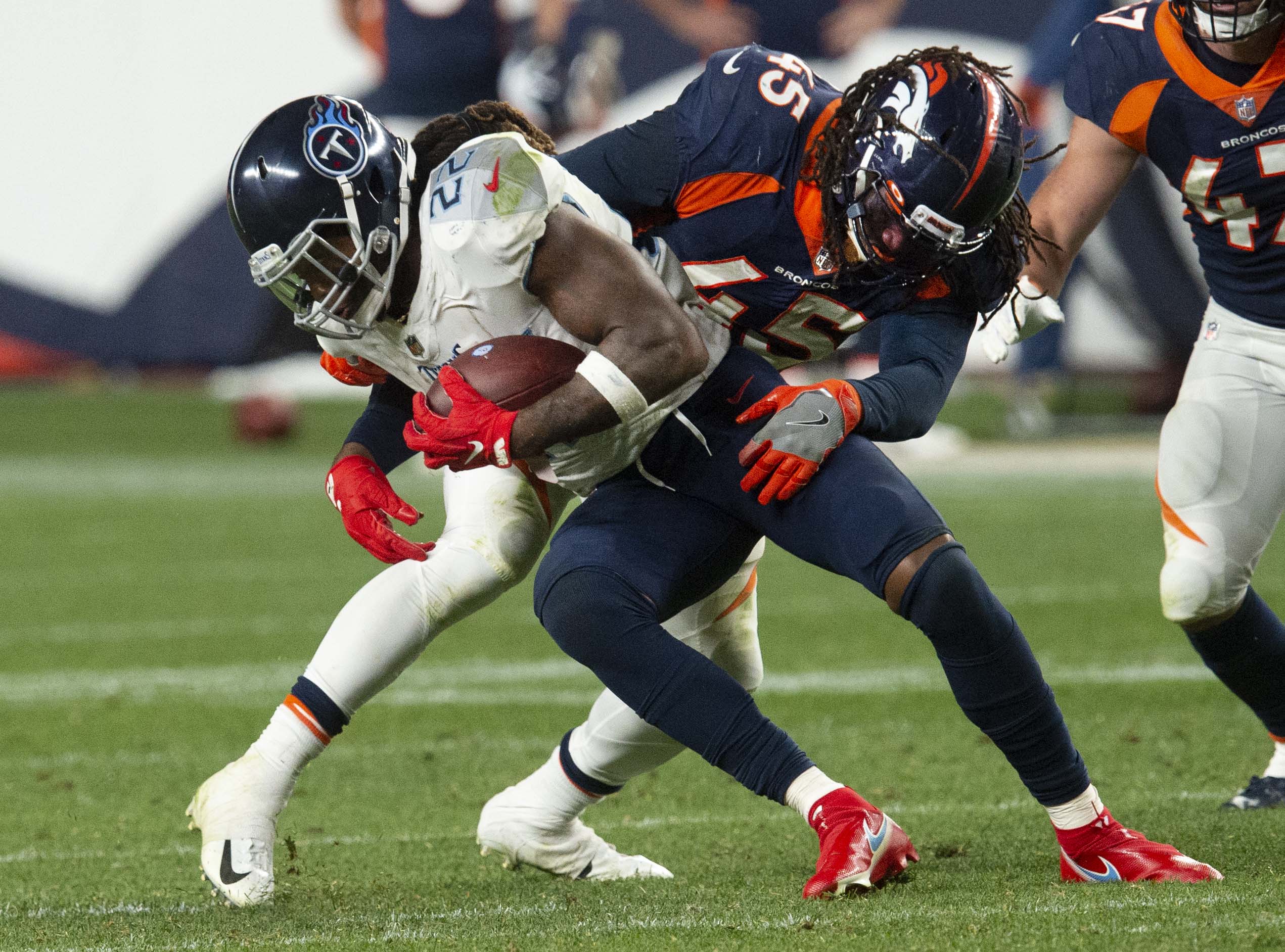 Denver Broncos linebacker A.J. Johnson (45) brings down Tennessee Titans running back Derrick Henry (22) during the fourth quarter Monday, Sept. 14, 2020, at Empower Field at Mile High in Denver.The Titans won 16-14. (The Gazette, Christian Murdock) (Christian Murdock/The Gazette)