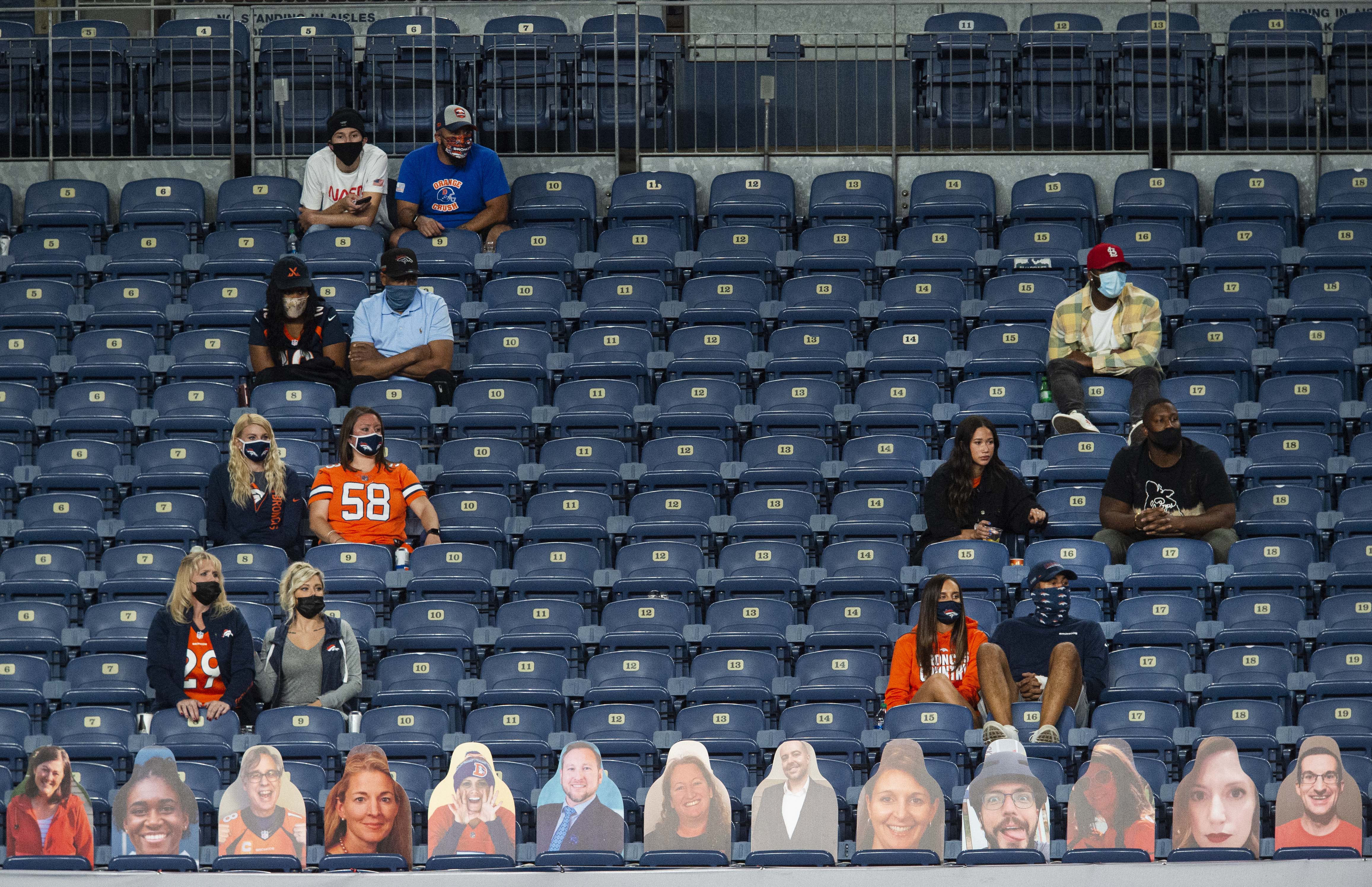 A small group of family and friends watch the Broncos play against the Tennessee Titans during the third quarter Monday, Sept. 14, 2020, at Empower Field at Mile High in Denver.The Titans won 16-14. (The Gazette, Christian Murdock) (Christian Murdock/The Gazette)