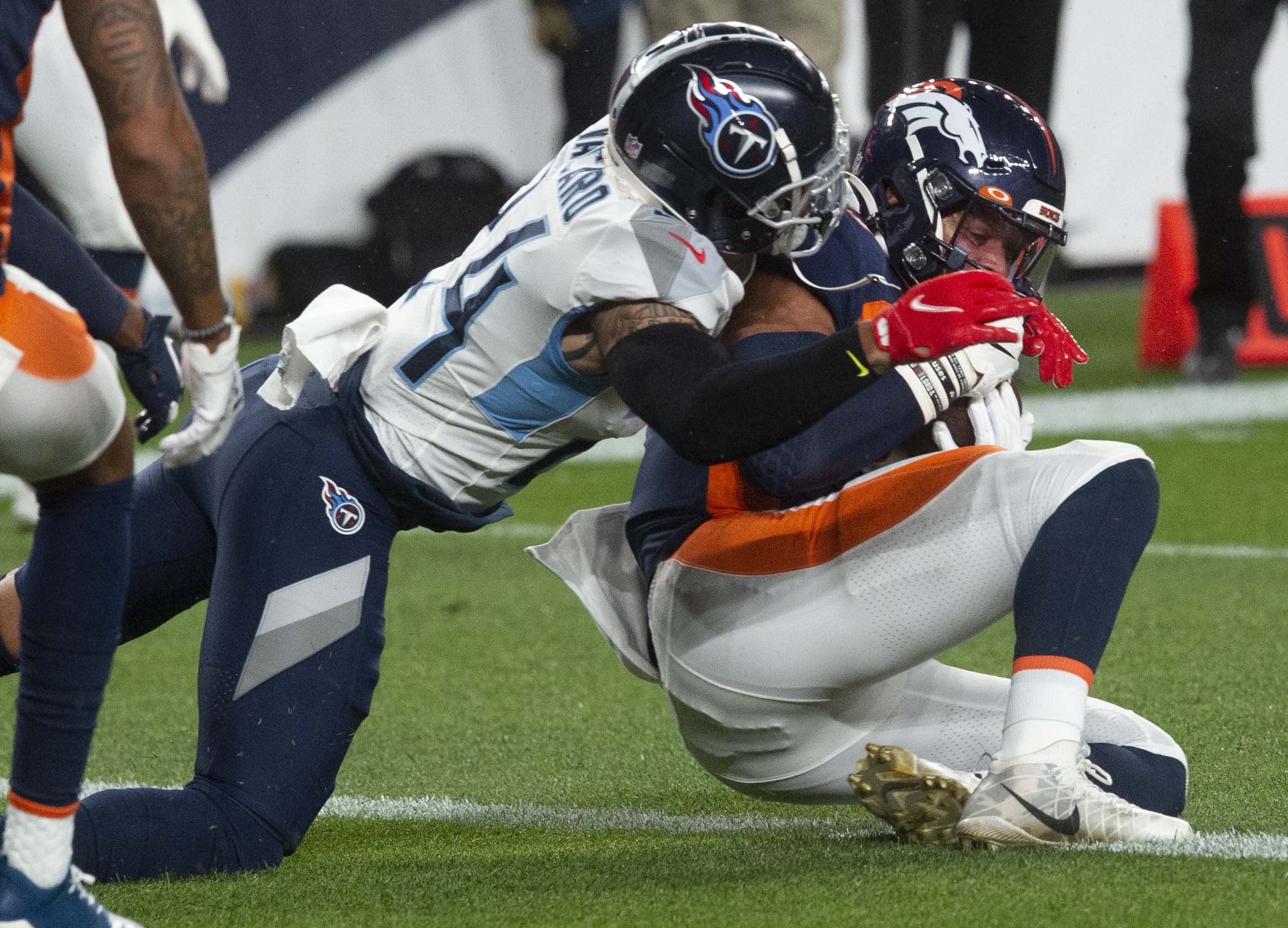 Denver Broncos tight end Noah Fant (87) hauls in a pass from Denver Broncos quarterback Drew Lock (3) for a touchdown as Tennessee Titans strong safety Kenny Vaccaro (24) defends during the first quarter Monday, Sept. 14, 2020, at Empower Field at Mile High in Denver. (The Gazette, Christian Murdock) (Christian Murdock/The Gazette)