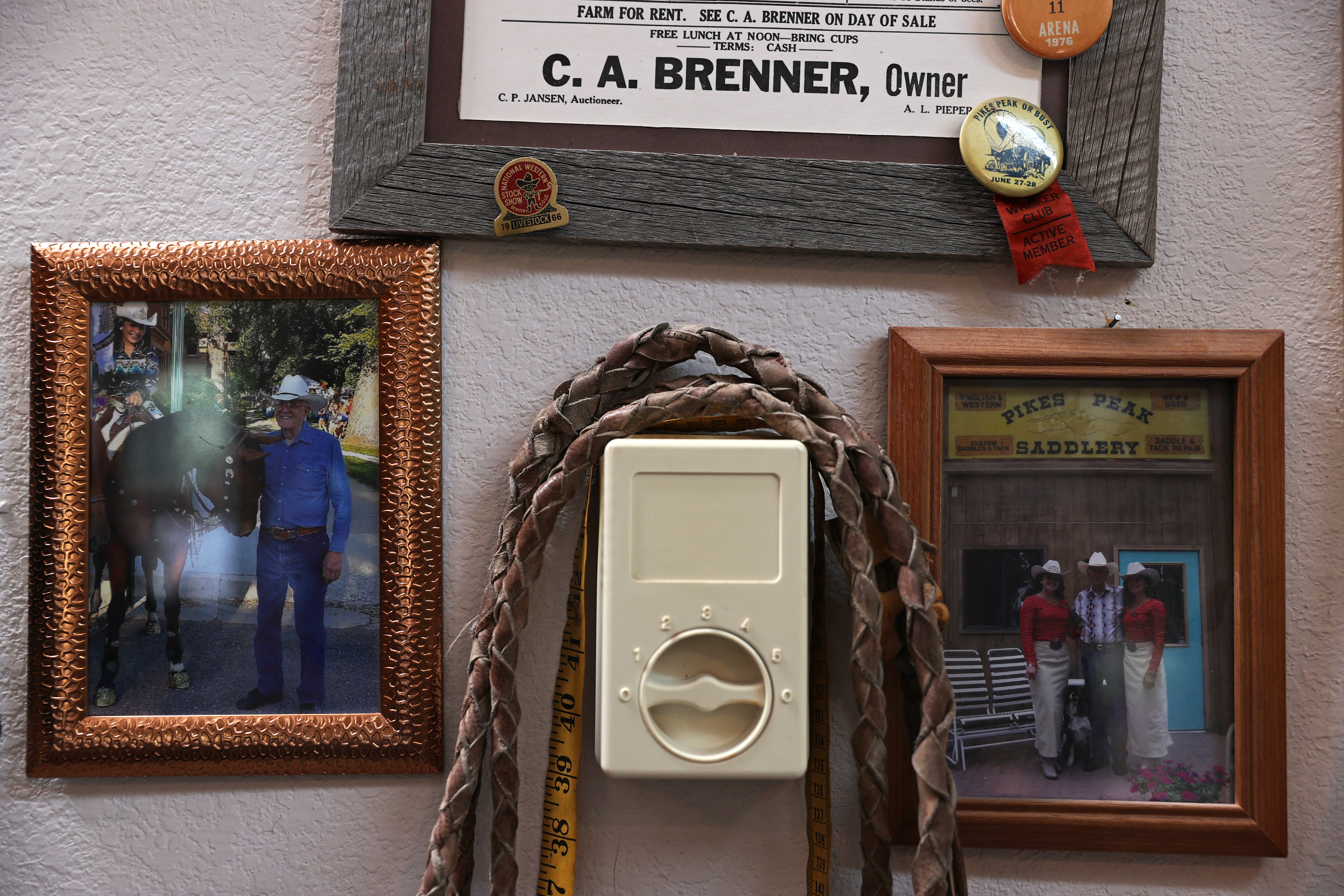 Photos of Bob Brenner with the Girls of The West, a 1928 ranch auction certificate from Brenner’s grandfather and a handmade lead rope from the 1920s adorn the wall of Brenner’s saddle shop in Black Forest on Sept. 1, 2020. The lead rope was hand stitched from the tops of cowboy boots in the 1920s by Brenner’s grandfather, who owned a large ranch in the Colorado Springs area. Brenner owns Pikes Peak Saddlery and has been restoring and making custom saddles since the 1970s. (Forrest Czarnecki/The Gazette) (Forrest Czarnecki)