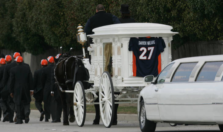 The funeral cortege for Denver Bronco Darrent Williams with his casket in a horse-drawn carriage leaves the Great Commission Baptist Church en route to the cemetery Jan. 6, 2007, in Fort Worth, Texas. Williams was gunned down early New Year’s Day 2007 in a drive-by shooting in downtown Denver. (the ROCKY MOUNTAIN NEWS file photos)