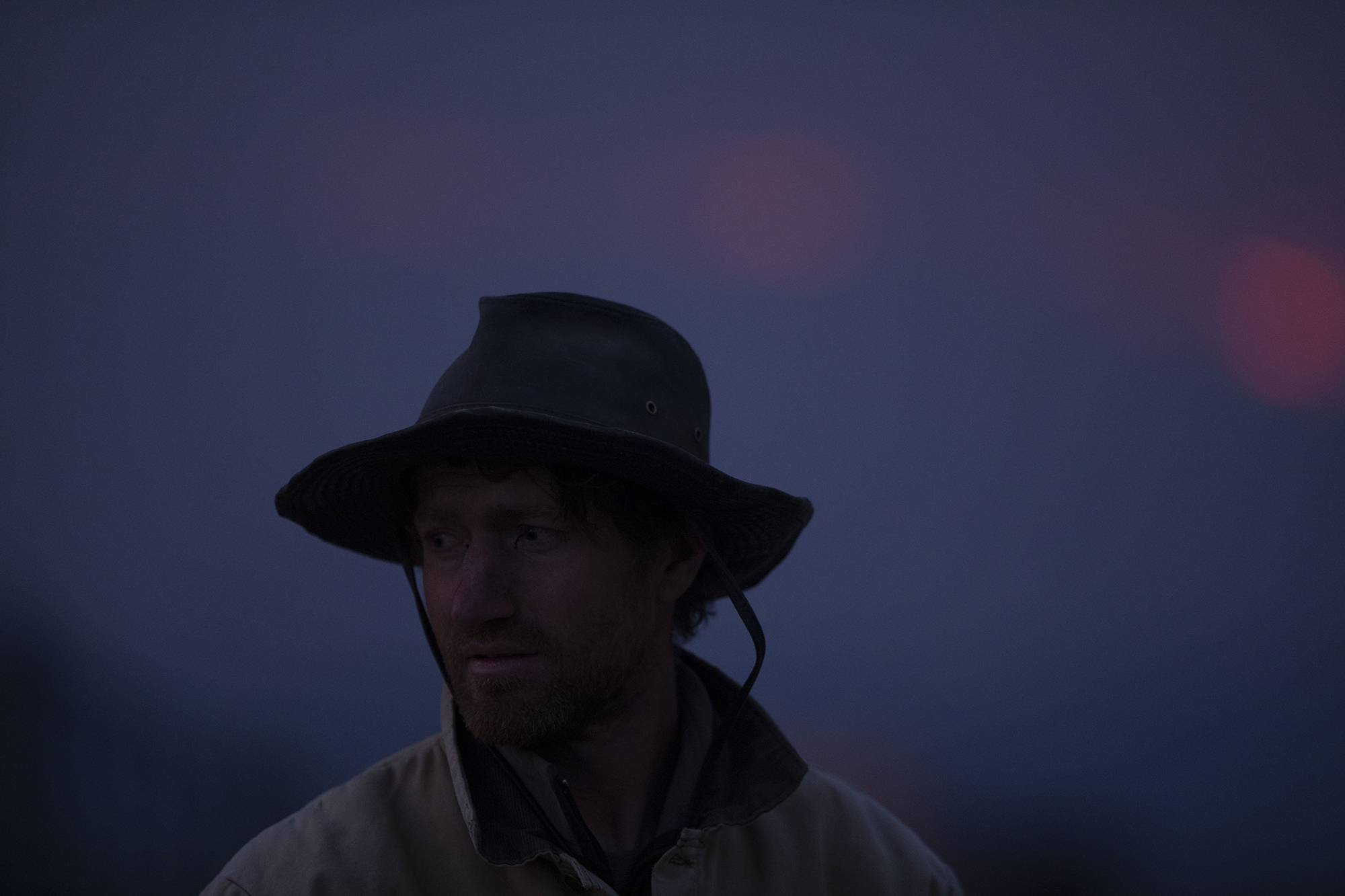 Asa Holley watches the East Troublesome fire burn along the ridge across from his family farm, Sisu Farms in Granby, in Grand County on Thursday, Oct. 22, 2020. The East Troublesome fire has grown to be the second-largest wildfire in Colorado history. (Chancey Bush/ The Gazette) (Chancey Bush The Gazette)