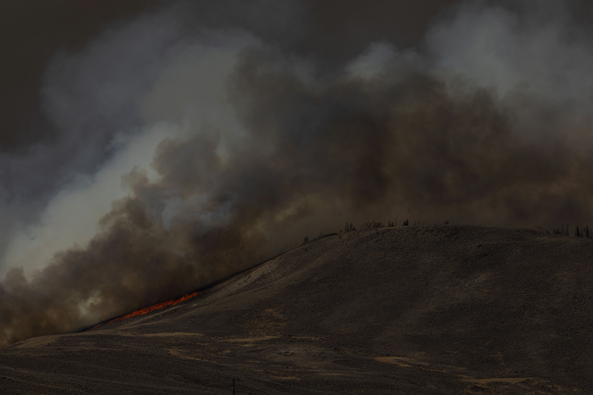 The East Troublesome fire burns along the ridge near Granby, Colo., in Grand County on Thursday, Oct. 22, 2020. The East Troublesome fire has grown to be the second-largest wildfire in Colorado history. (Chancey Bush/ The Gazette) (Chancey Bush The Gazette)