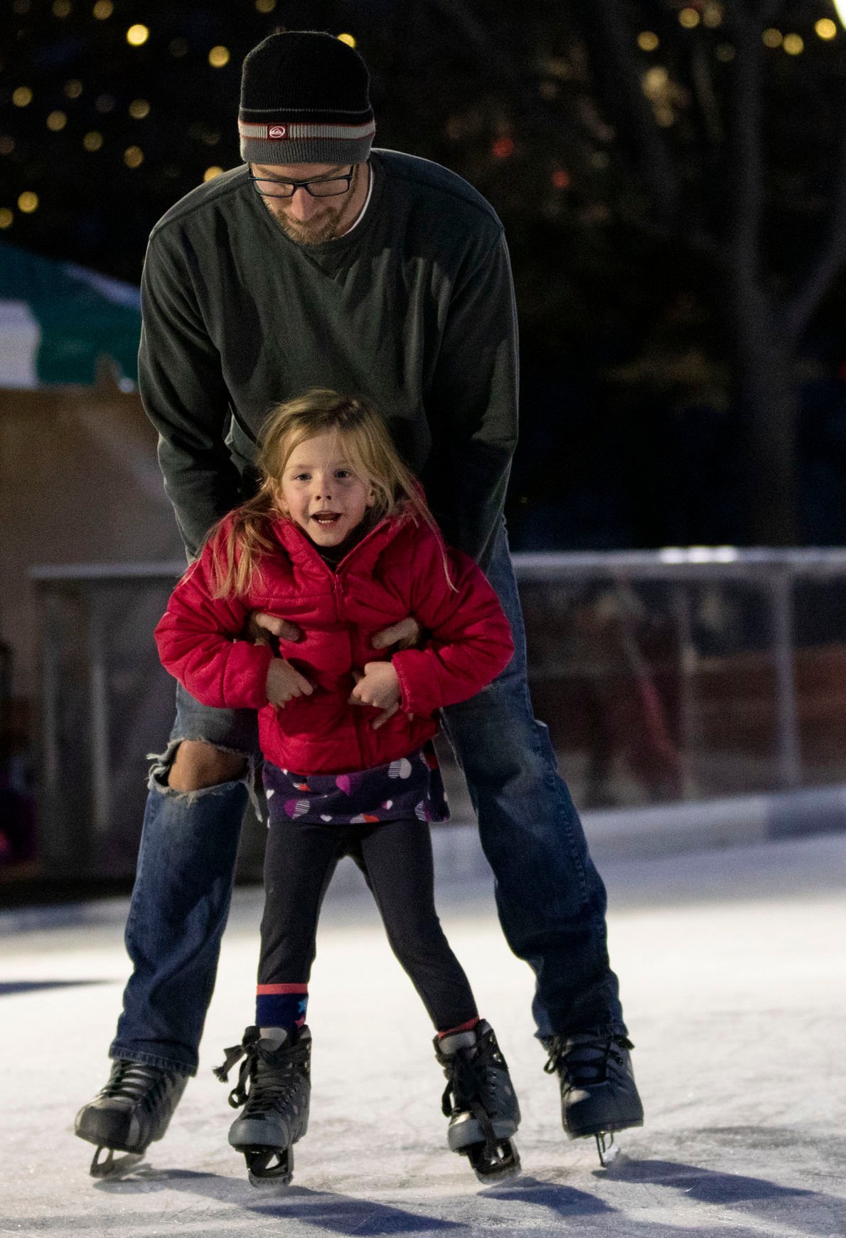 Jack Haflett ice skates with his daughter Eva, 5, during the grand opening celebration of Skate in the Park at Acacia Park in downtown Colorado Springs on Friday, Nov. 15, 2019. (Chancey Bush/ The Gazette)