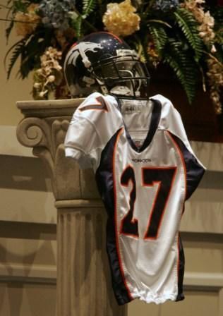 Broncos cornerback Darrent Williams’ jersey and helmet were on display at his 2007 funeral. Photo by THE ASSOCIATED PRESS