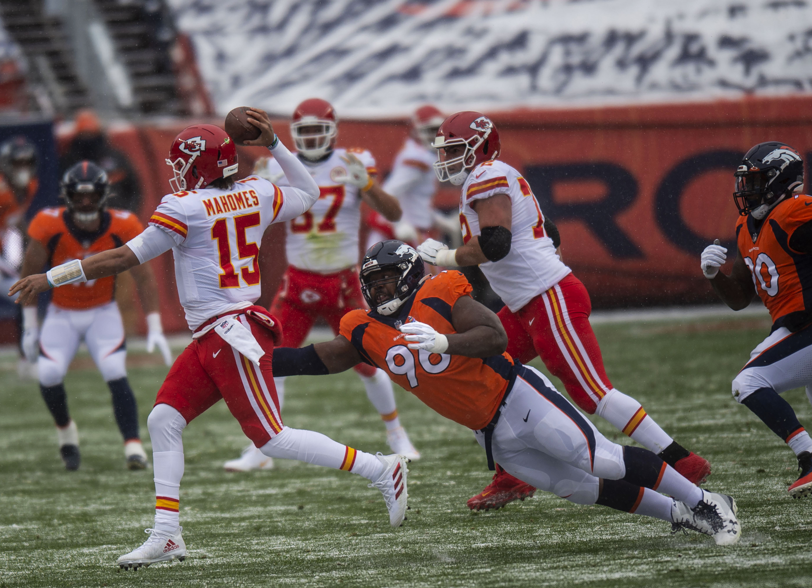 Denver Broncos defensive end Shelby Harris (96) attempts to tackle Kansas City Chiefs quarterback Patrick Mahomes (15) during the Denver Broncos home game against the Kansas City Chiefs at Empower Field at Mile High in Denver, Colo., on Sunday, Oct. 25, 2020. The Broncos lost to the Chiefs by a score of 43-16.(Chancey Bush/ The Gazette) (ChristianMurdock)