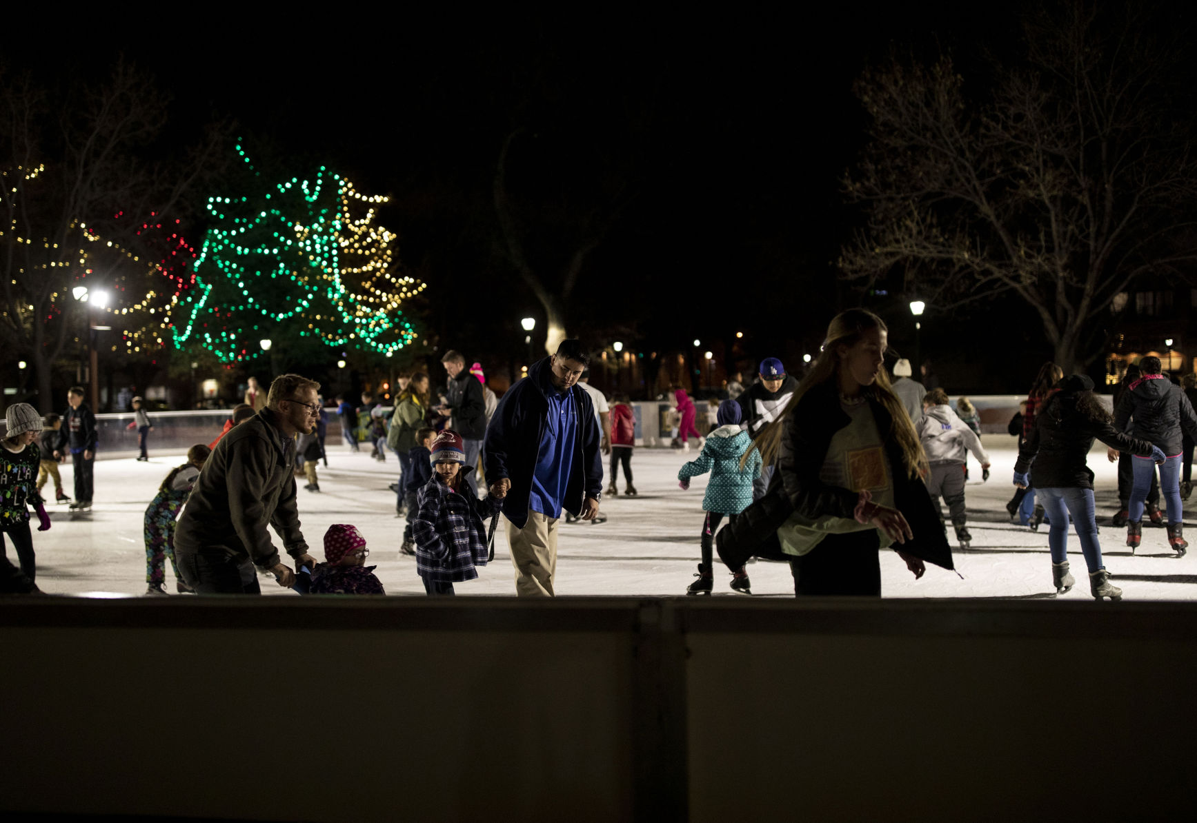 Chancey Bush/The GazettePeople ice skate during the grand opening celebration of Skate in the Park at Acacia Park in downtown Colorado Springs on Nov. 15, 2019.