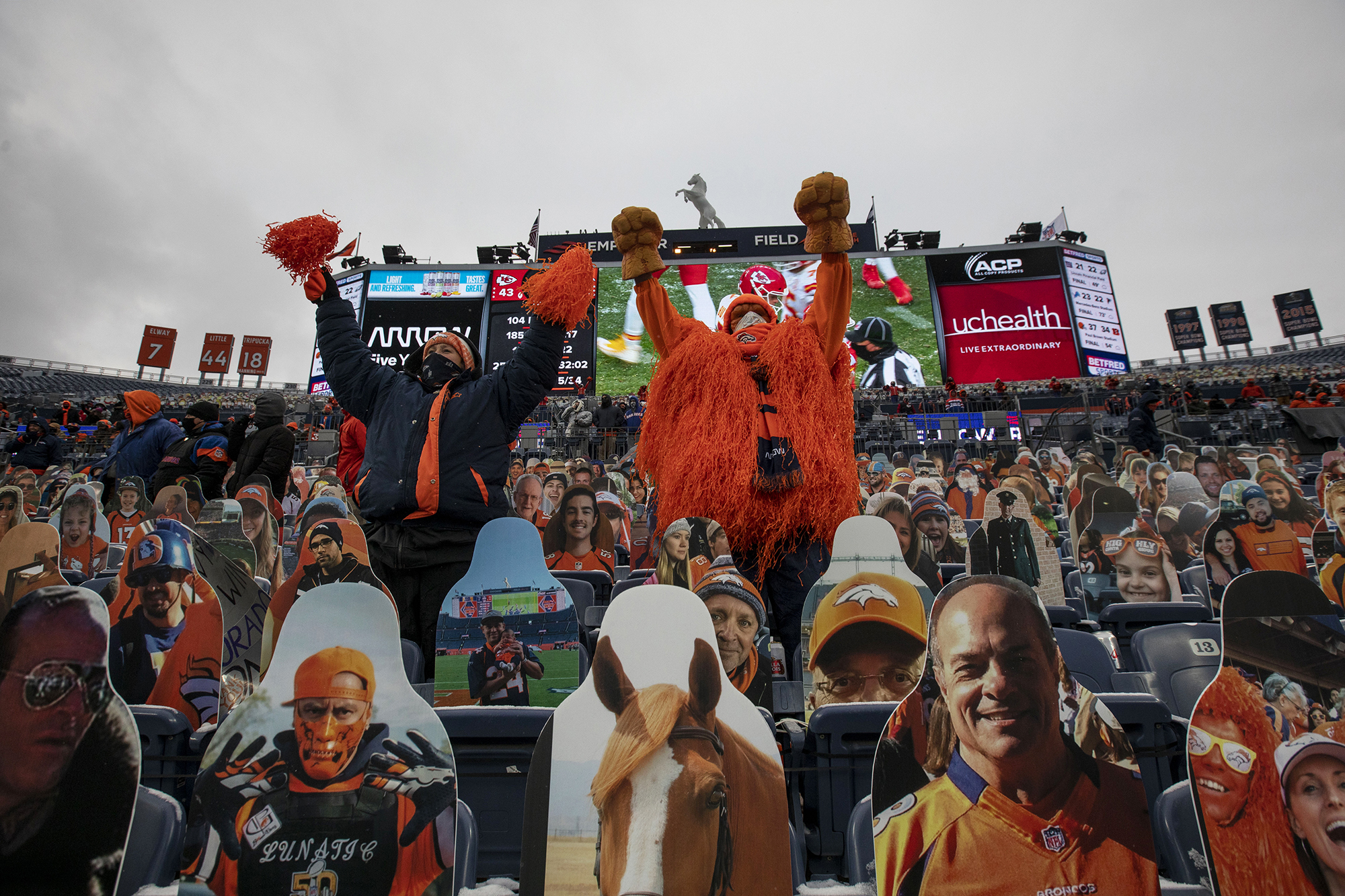 Christi Ramey, left, and Darren Droge, the Orange Crusher, right, hold their arms up as the Chiefs attempt a field goal during the second half of the Denver Broncos home game against the Kansas City Chiefs at Empower Field at Mile High in Denver, Colo., on Sunday, Oct. 25, 2020. The Broncos lost to the Chiefs by a score of 43-16.(Chancey Bush/ The Gazette) (Chancey Bush The Gazette)