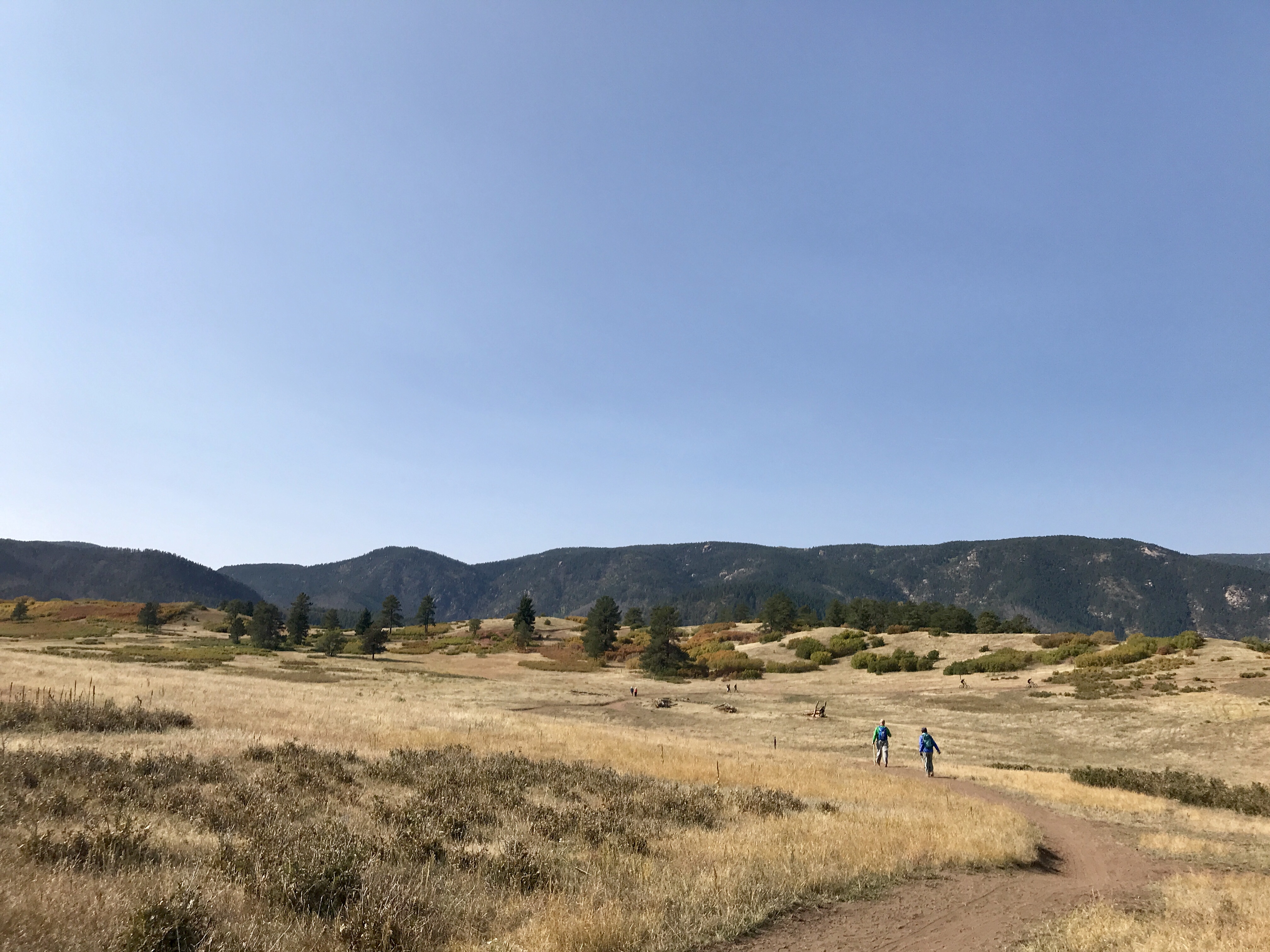 Hikers along the Sandstone Meadow loop trail overlooked by Pike National Forest at Sandstone Ranch, the new open space at Douglas County. Photo by Seth Boster, The Gazett