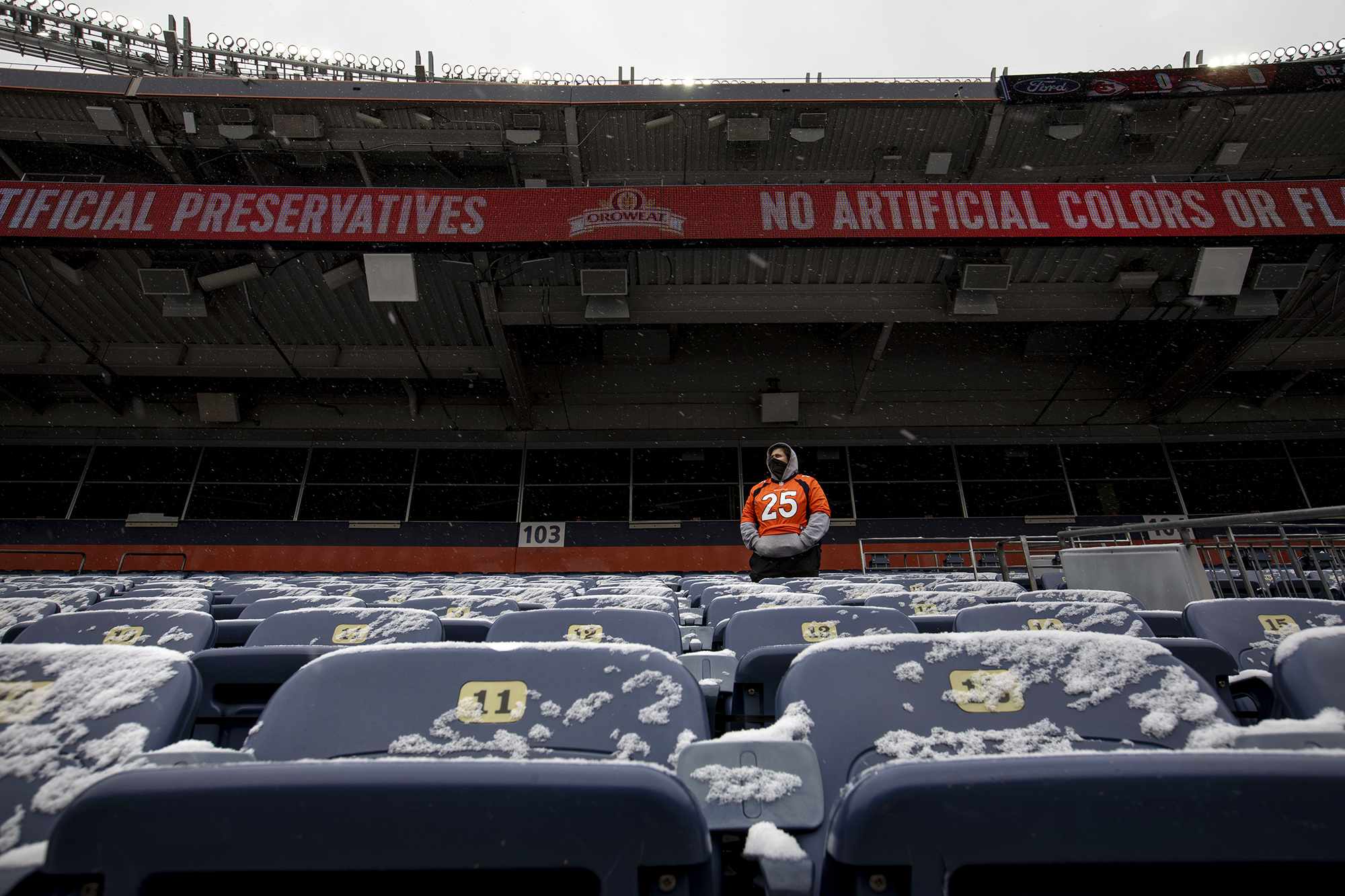 Debbie Watson waits for the game to start in the snowy stands before the Denver Broncos take on the Kansas City Chiefs at Empower Field at Mile High in Denver, Colo., on Sunday, Oct. 25, 2020. (Chancey Bush/ The Gazette) (Chancey Bush The Gazette)