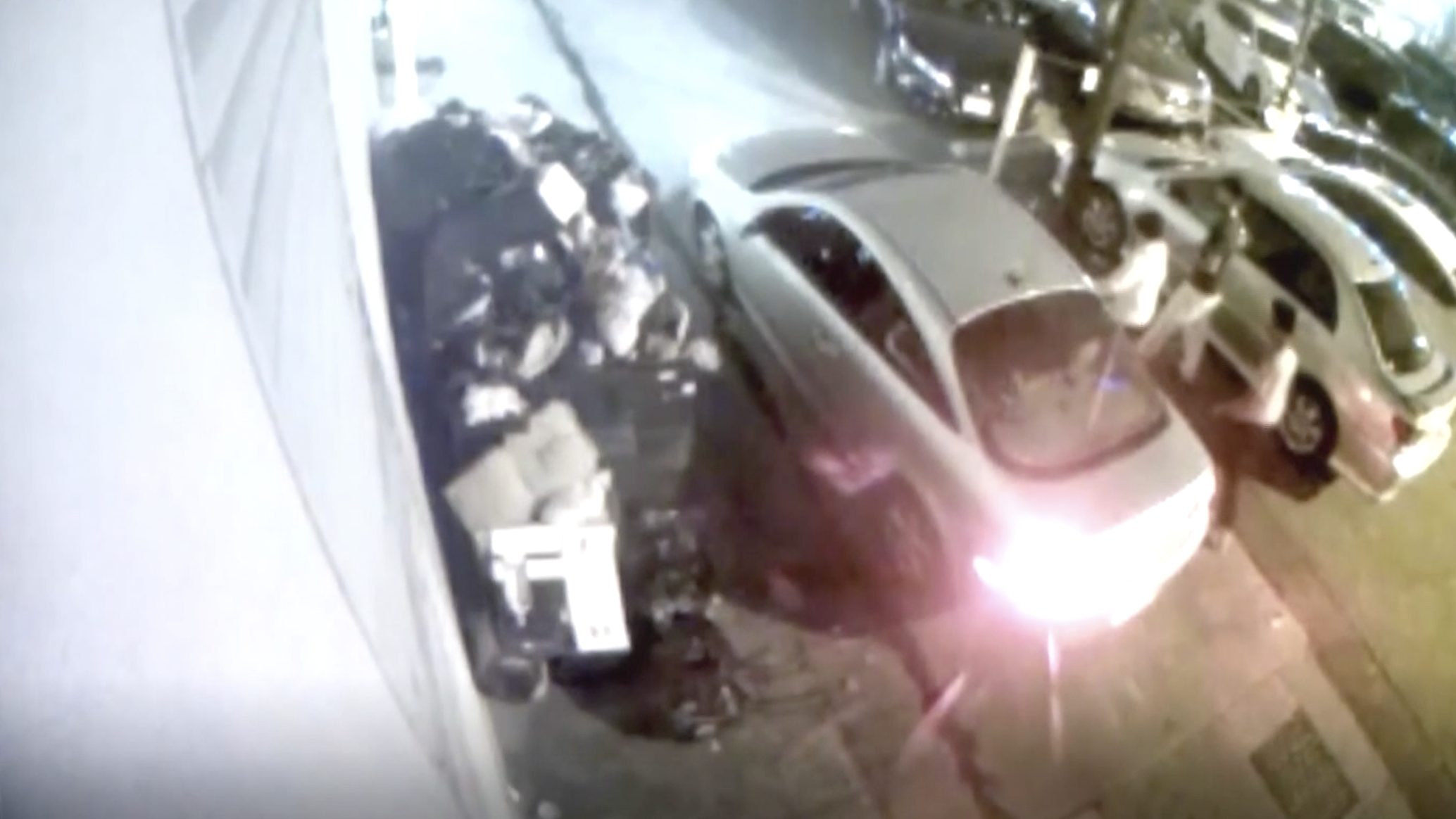 Three individuals seen approaching and opening the door of the vehicle involved in a fatal hit-and-run 15 minutes before the collision. (Photo courtesy of the Denver Police Department)