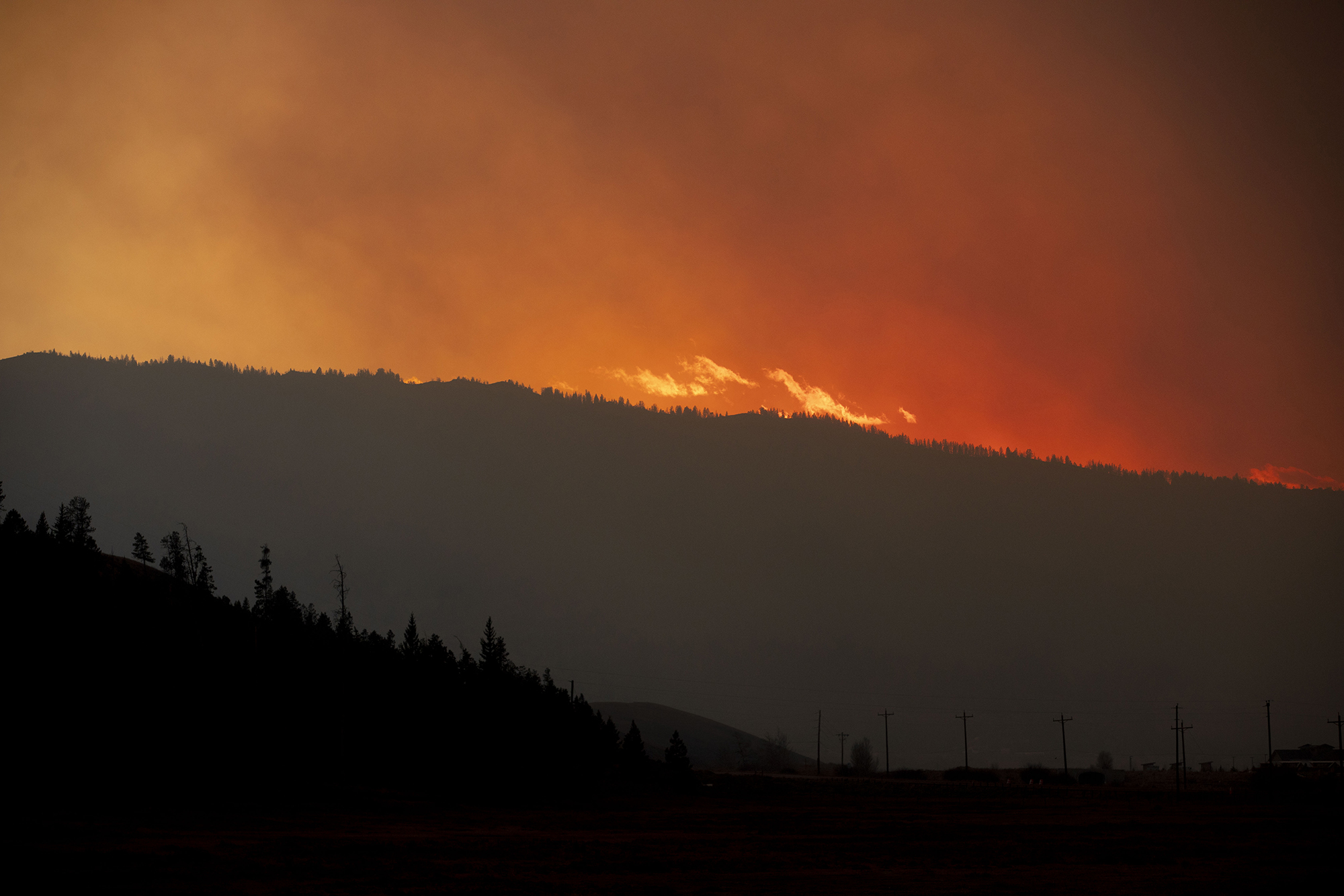 Smoke fills the sky at sunset at the East Troublesome fire burns close to the town of Granby in Grand County on Thursday, Oct. 22, 2020. The East Troublesome fire has grown to be the second-largest wildfire in Colorado history. (Chancey Bush/ The Gazette) (Chancey Bush The Gazette)