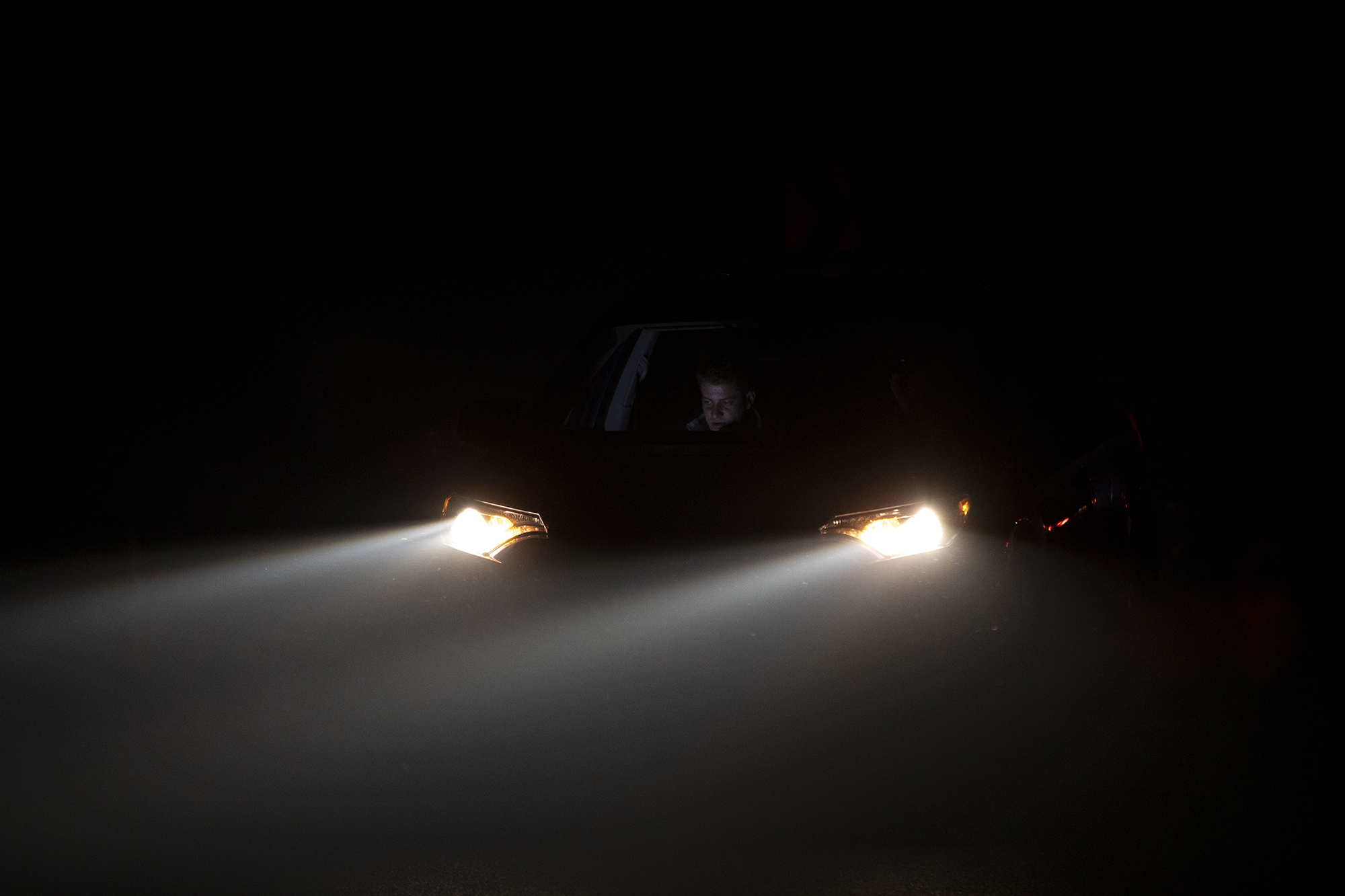 Marc Sallinger, a journalist with 9News, works in his vehicle as heavy smoke fills the air in Granby due to the East Troublesome fire in Grand County on Thursday, Oct. 22, 2020. (Chancey Bush/ The Gazette) (Chancey Bush The Gazette)