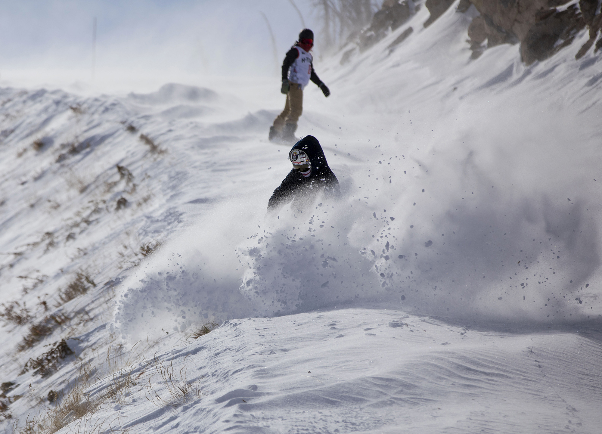 A snowboarder carves snow on the Bonanza Trail at Wolf Creek Ski Area in Colorado on Wednesday, Oct. 28, 2020. Wolf Creek is the first ski area in Colorado to open for the 2020-21 season, with a snow total of 24 inches. Treasure, Bonanza and Nova lifts are in full operation. Due to COVID-19, all indoor facilities are closed, excluding bathrooms, social distancing and wearing of masks are required. (Chancey Bush/ The Gazette) (Chancey Bush The Gazette)