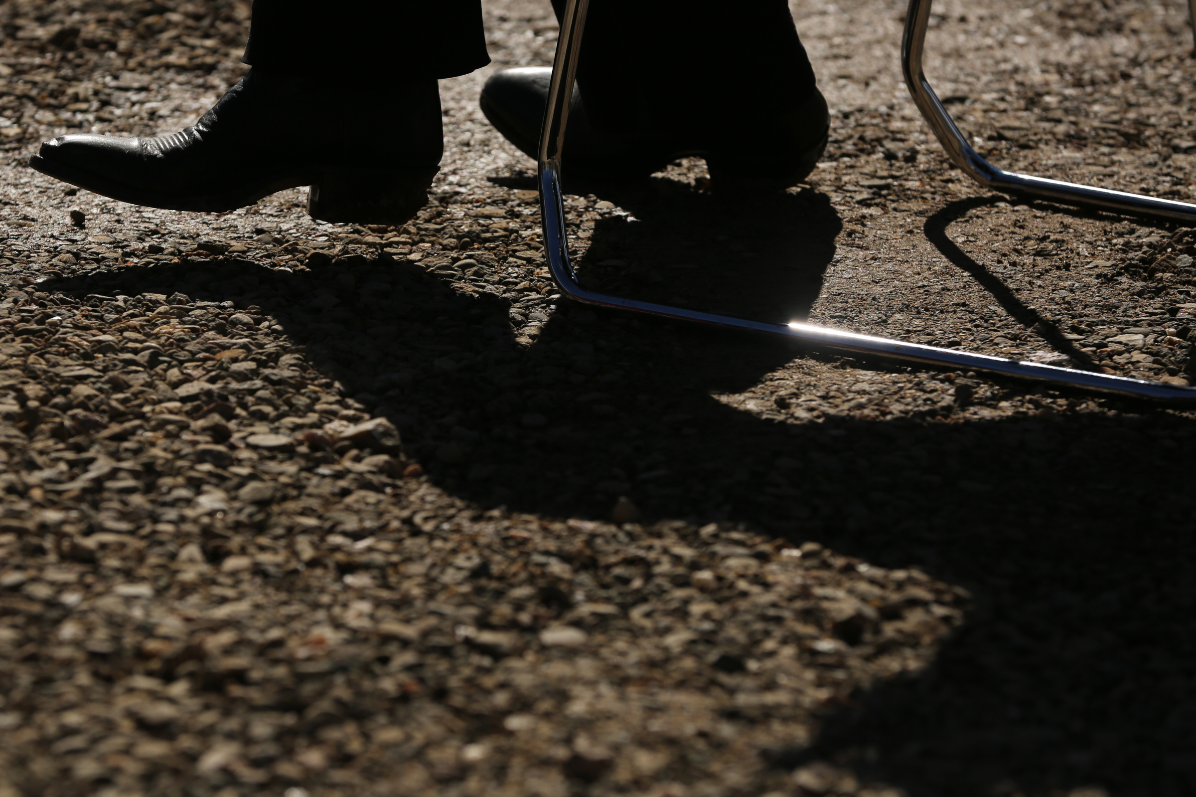 A reporter in cowboy boots listens to the opening remarks at the grand opening of Fishers Peak State Park near Trinidad, Colorado on Oct. 30, 2020. (Forrest Czarnecki/The Gazette) (Forrest Czarnecki)