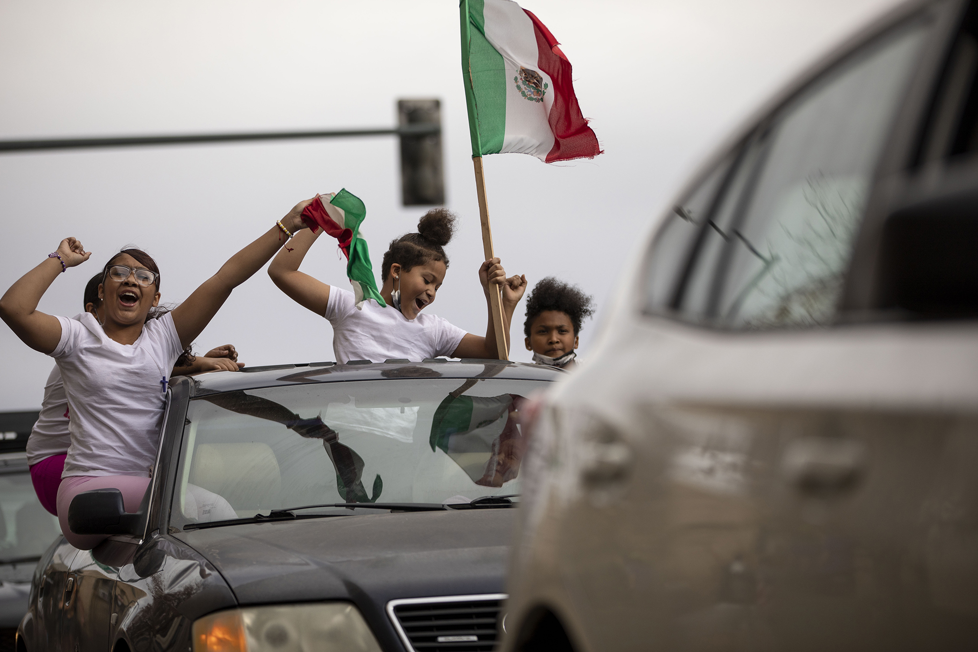 The Toledo family celebrates the victory of Democratic candidate Joseph Biden at the intersection of Lincoln Street and 13th Avenue in downtown Denver, Colo., on Saturday, Nov. 7, 2020. (Chancey Bush/ The Gazette) (Chancey Bush The Gazette)