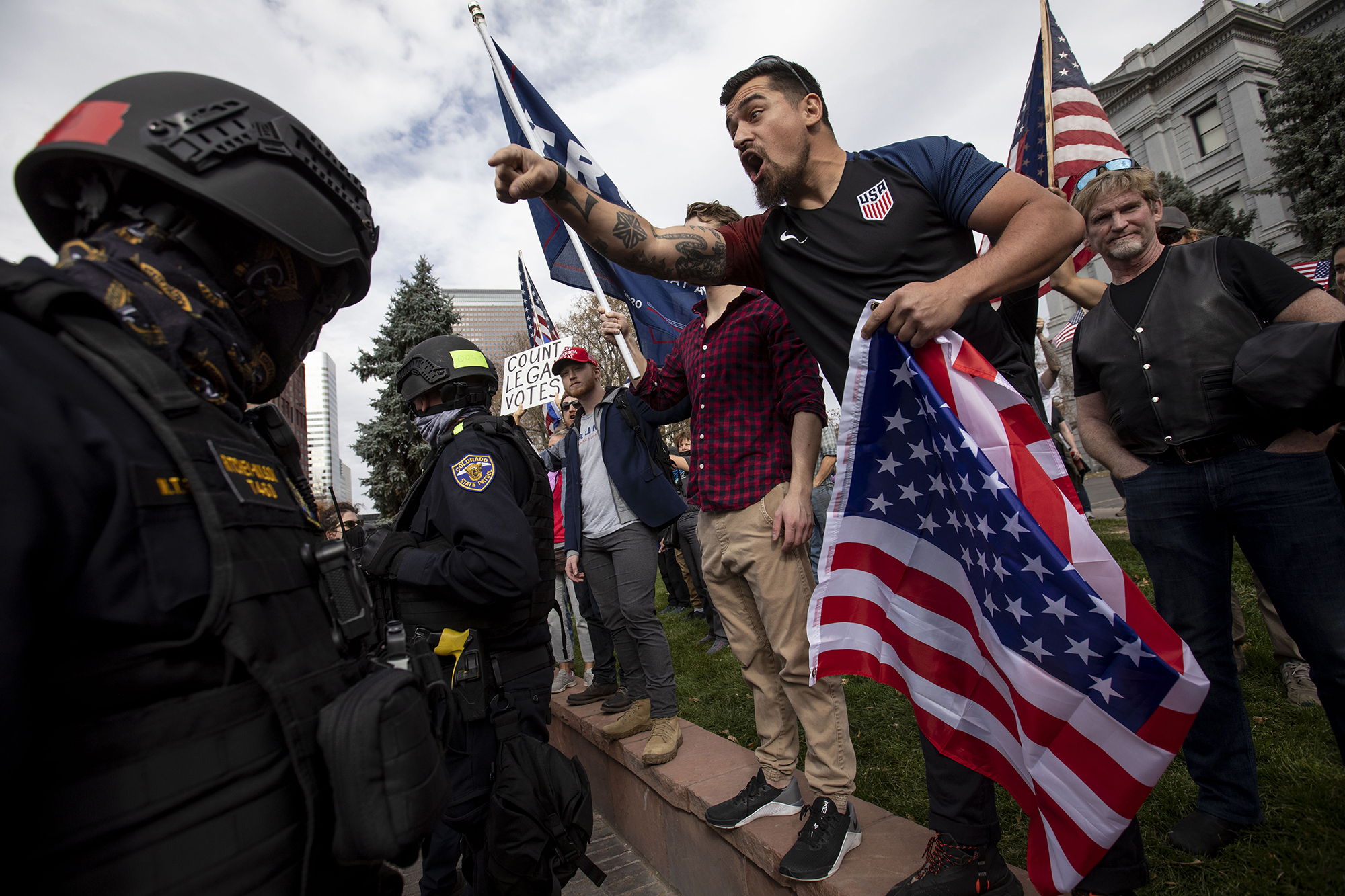 Tensions rise as a Trump supporter, who declined to give his name, exchanges words with Biden supporters at the Colorado State Capitol building in downtown Denver, Colo., on Saturday, Nov. 7, 2020. (Chancey Bush/ The Gazette) (Chancey Bush The Gazette)