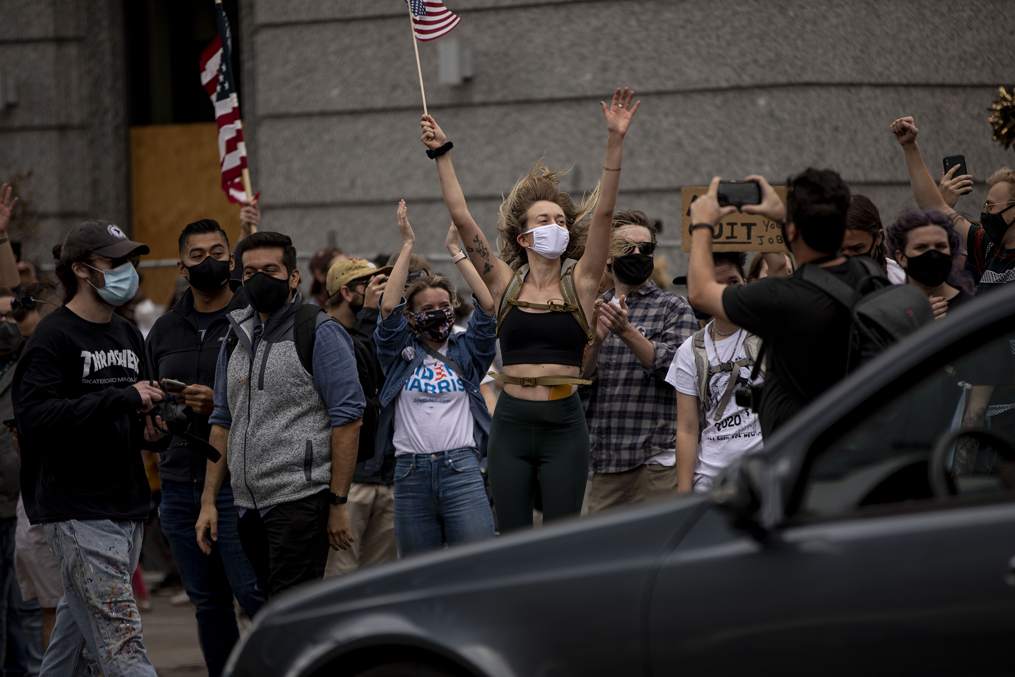 People celebrate the victory of Democratic candidate Joseph Biden at the intersection of Lincoln Street and 13th Avenue in downtown Denver, Colo., on Saturday, Nov. 7, 2020. (Chancey Bush/ The Gazette) (Chancey Bush The Gazette)