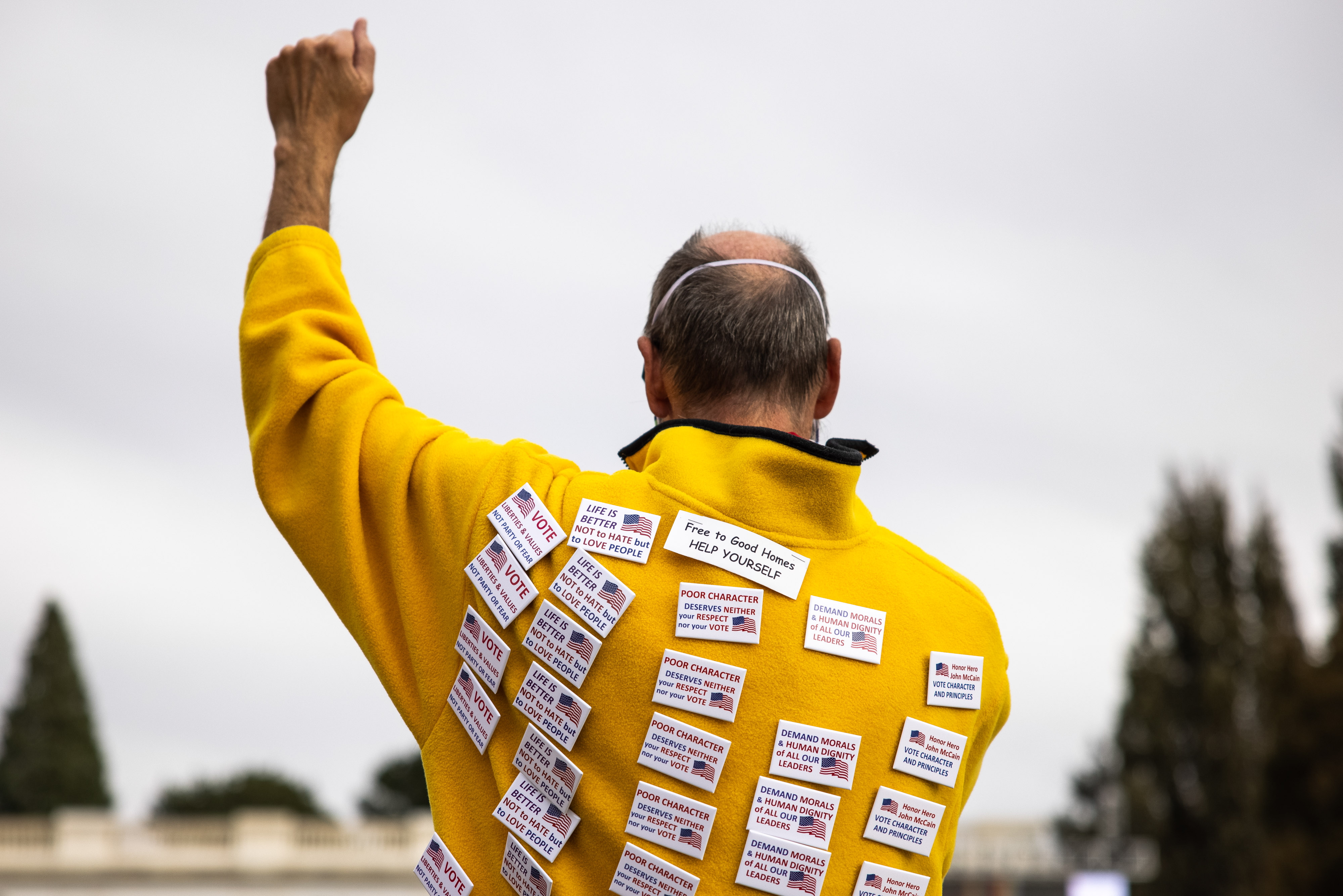 Kirk Sarell wears buttons on his jacket as people celebrate the announcement that Joe Biden was elected as the next president of the United States according to multiple news sources Saturday, Nov. 7, 2020 at Cheeseman Park in Denver. (Michael Ciaglo/Special to The Denver Gazette) (Michael Ciaglo/Special to The De)