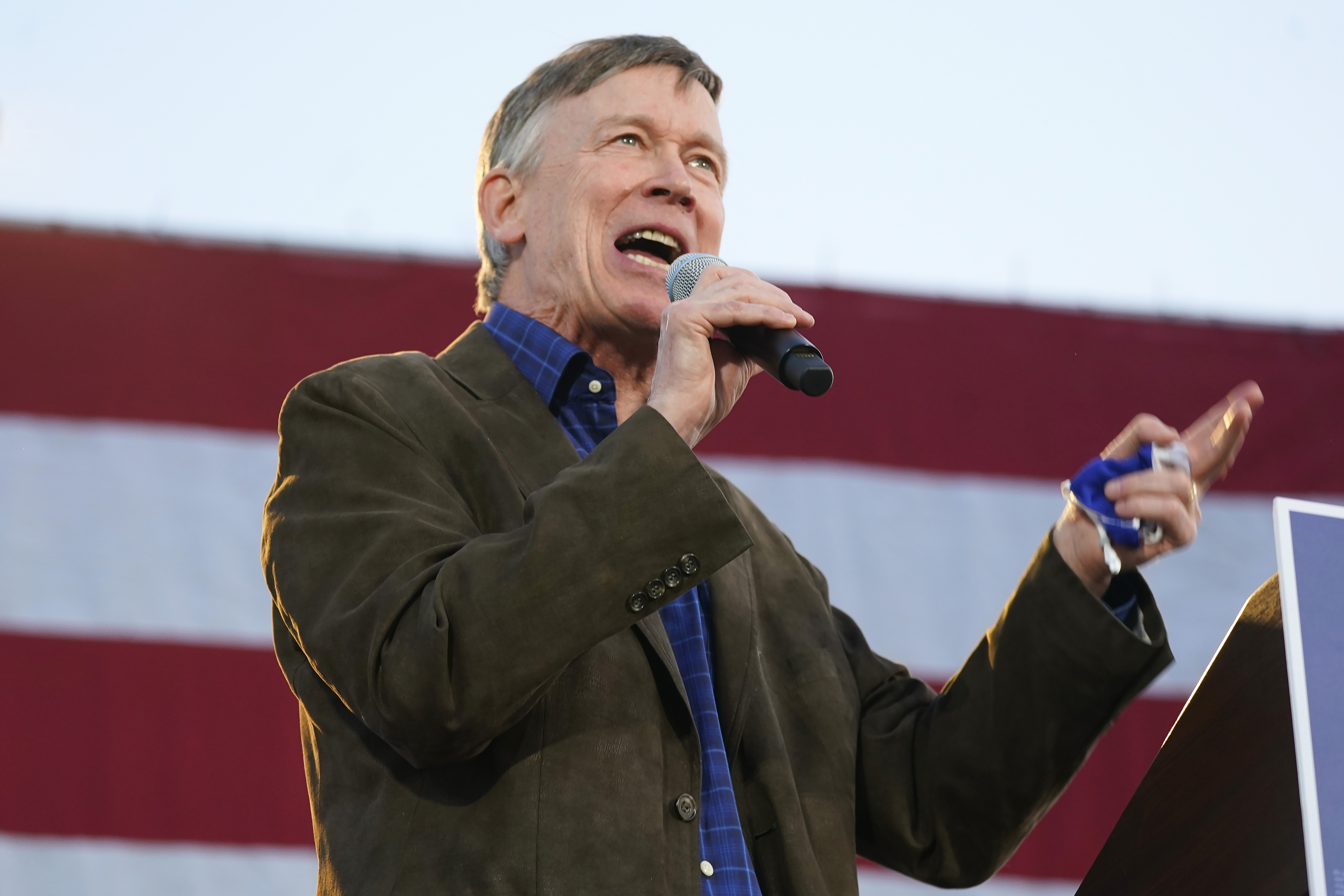 (AP Photo/David Zalubowski, File) In this Oct. 8, 2020, file photo, John Hickenlooper, Democratic candidate for the U.S. Senate seat in Colorado, speaks during a car rally in Denver. ((AP Photo/David Zalubowski, File))