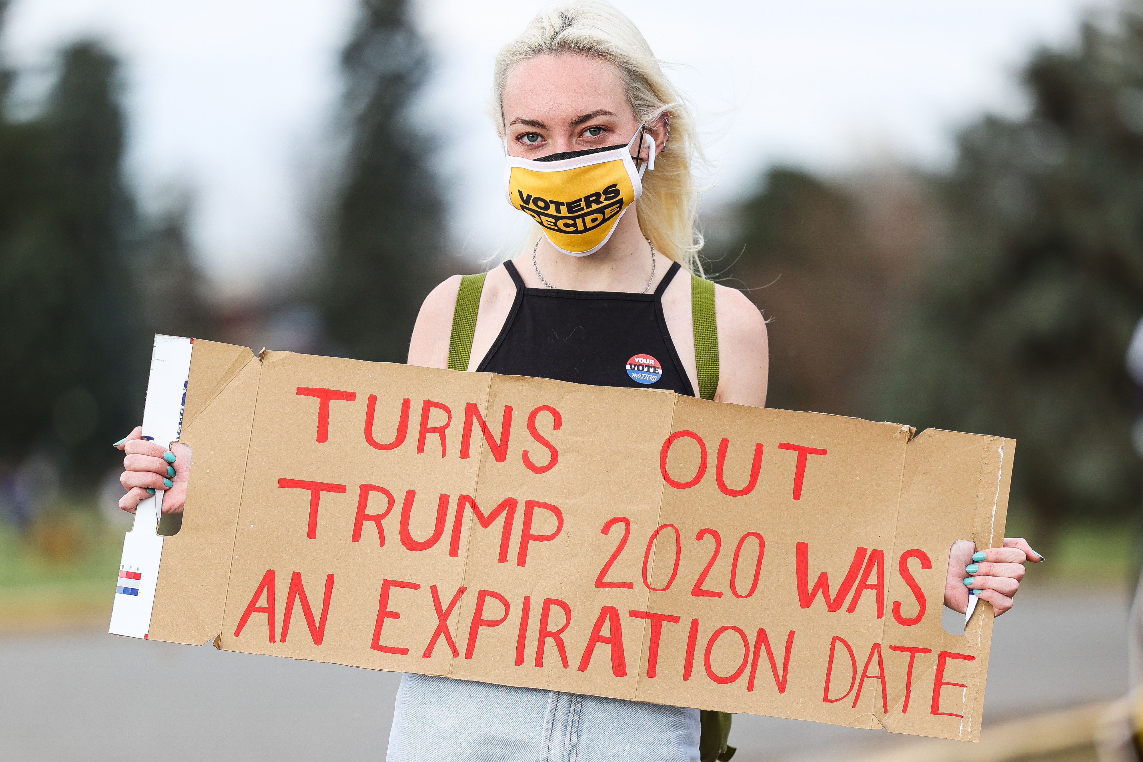 Rachel Shea holds a sign as people celebrate the announcement that Joe Biden was elected as the next president of the United States according to multiple news sources Saturday, Nov. 7, 2020 at Cheeseman Park in Denver. (Michael Ciaglo/Special to The Denver Gazette) (Michael Ciaglo/Special to The De)