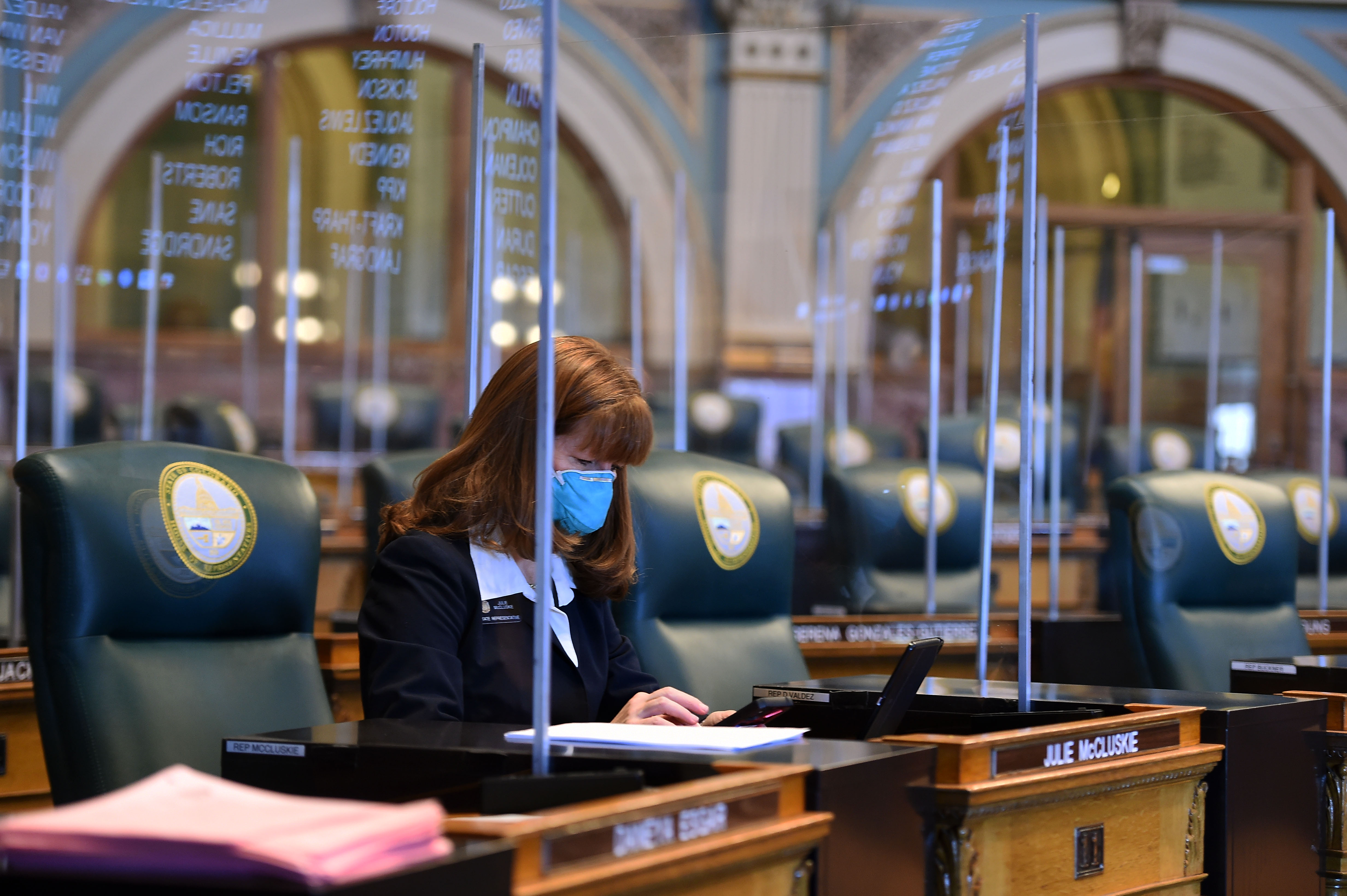 State lawmakers returned to the Capitol on Monday for a special session to work on bills tied to COVID-19. State Rep. Julie McCluskie, Democrat, gets ready for the first day of the session on Monday, Nov. 30, 2020. (JERILEE BENNETT, The Gazette)