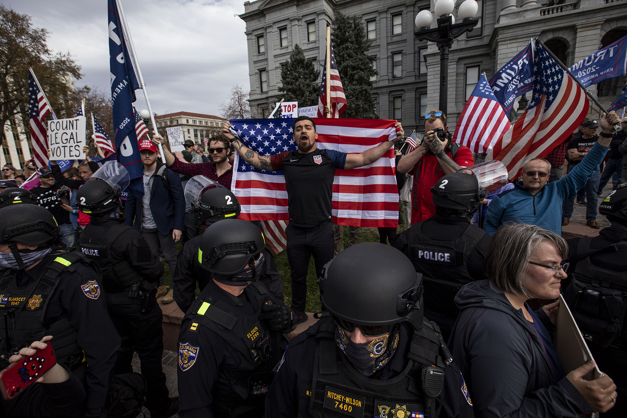 Tensions rise as a Trump supporters exchanges words with Biden supporters at the Colorado State Capitol building in downtown Denver, Colo., on Saturday, Nov. 7, 2020. (Chancey Bush/ The Gazette) (Chancey Bush The Gazette)