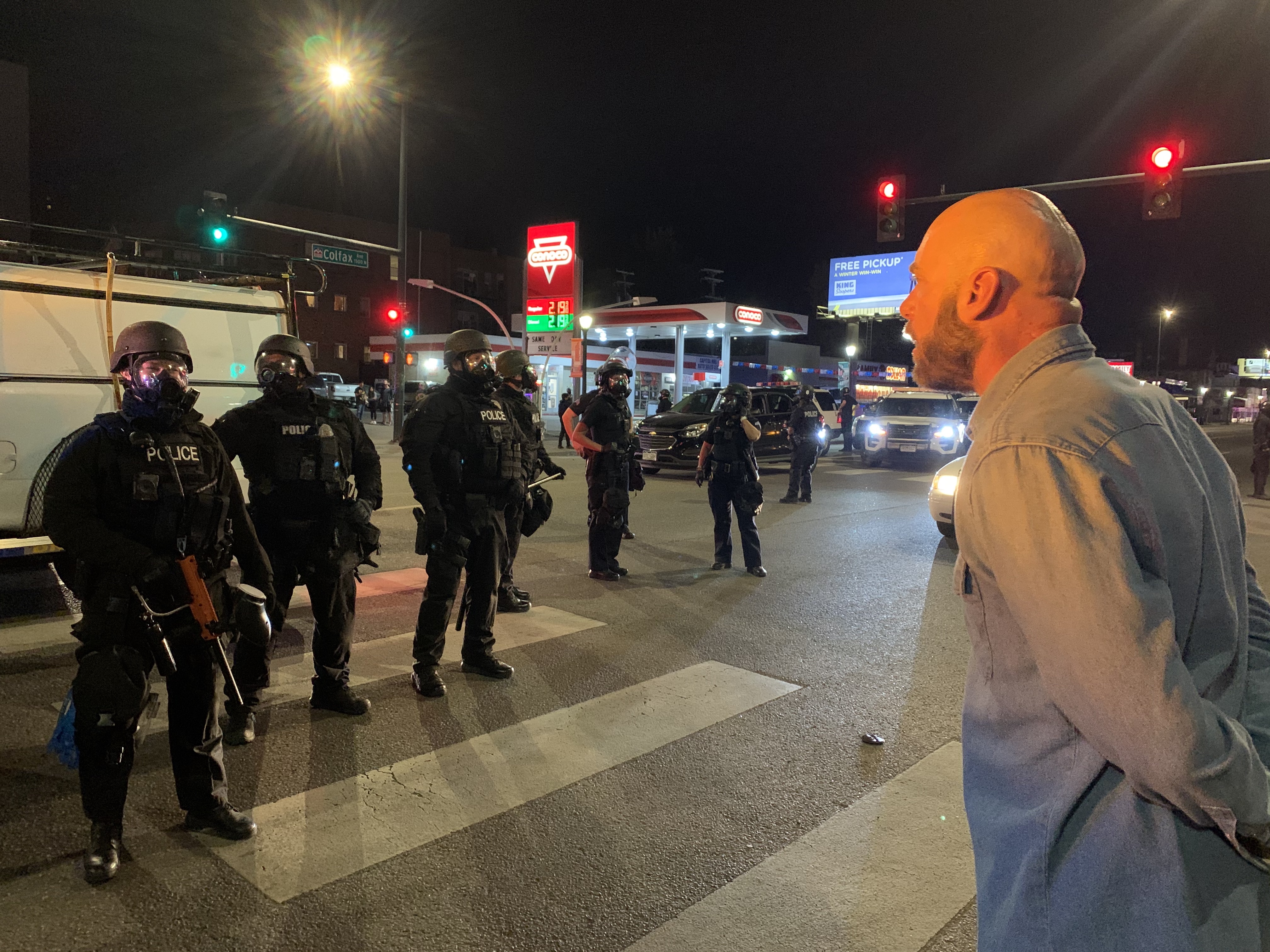 Denver resident Micah Wills asks officers why they are in his neighborhood dressed as if they're going to war during a Wednesday night protest in Denver. (DavidMullenBreaking News Reporterdavid.mullen@gazette.comhttps://secure.gravatar.com/avatar/349fcb3ec304c9bbf2b50a05578938e7?d=mm&r=g)