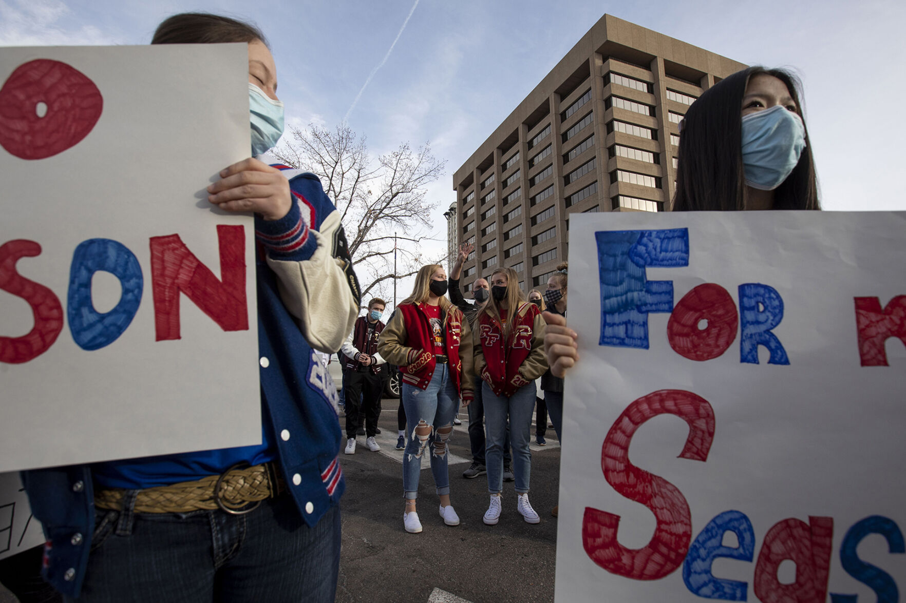 Rocky Ford seniors Gracie Moreland and Lily Hancock gather with fellow student athletes outside the office of the Colorado Department of Public Health and Environment in Glendale, Colo., on Thursday, Dec. 17, 2020. Around 70 students, parents and coaches participated in response to the CDPHE postponement of high school winter sports. (Chancey Bush/ The Gazette) (Chancey Bush)