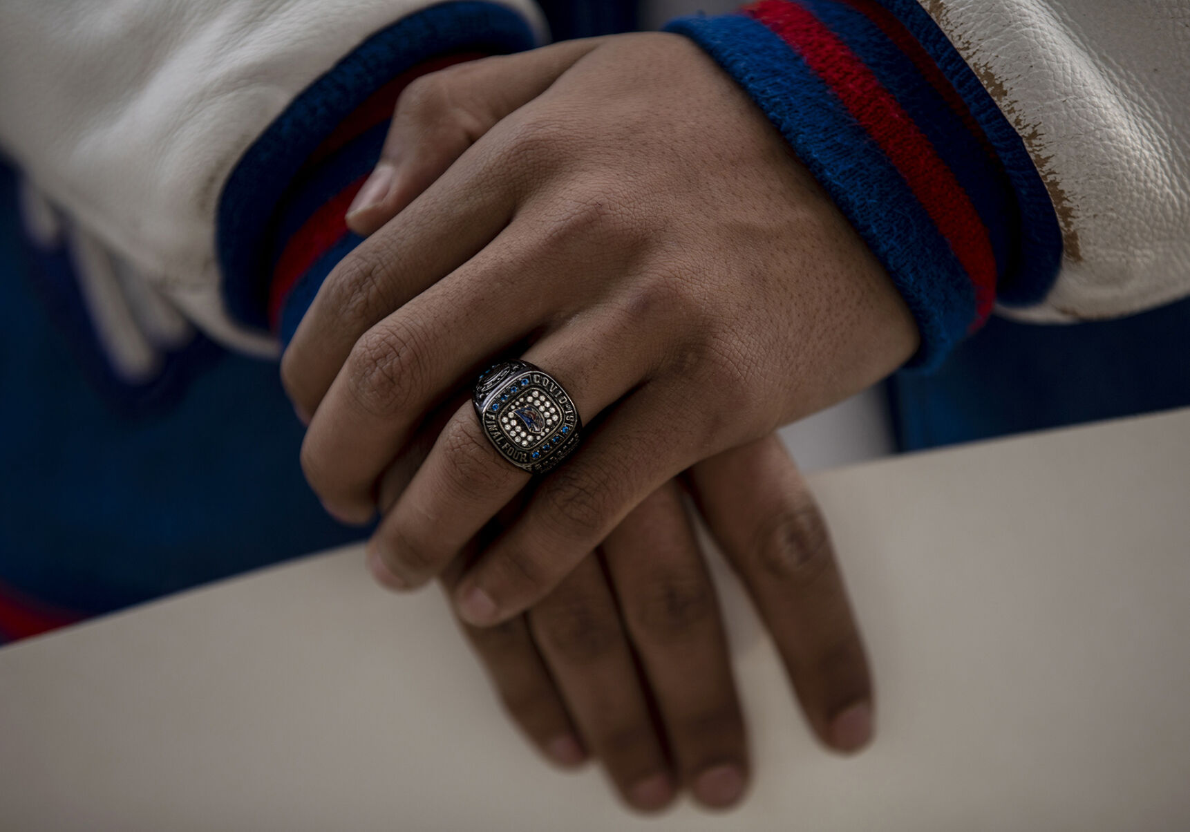 Briggsdale junior Malik Carlson wears his “COVID-19 Final Four” ring during the LetCOPlay protest at Creekside Park, across from the office of the Colorado Department of Public Health and Environment, in Glendale, Colo., on Thursday, Dec. 17, 2020. The Briggsdale boy's basketball team made it to the state championships for the first time in school history. The team defeated the defending state champions in the first round, the De Beque Dragons. The remaining state basketball championship rounds were cancelled due to the rise of COVID-19. 