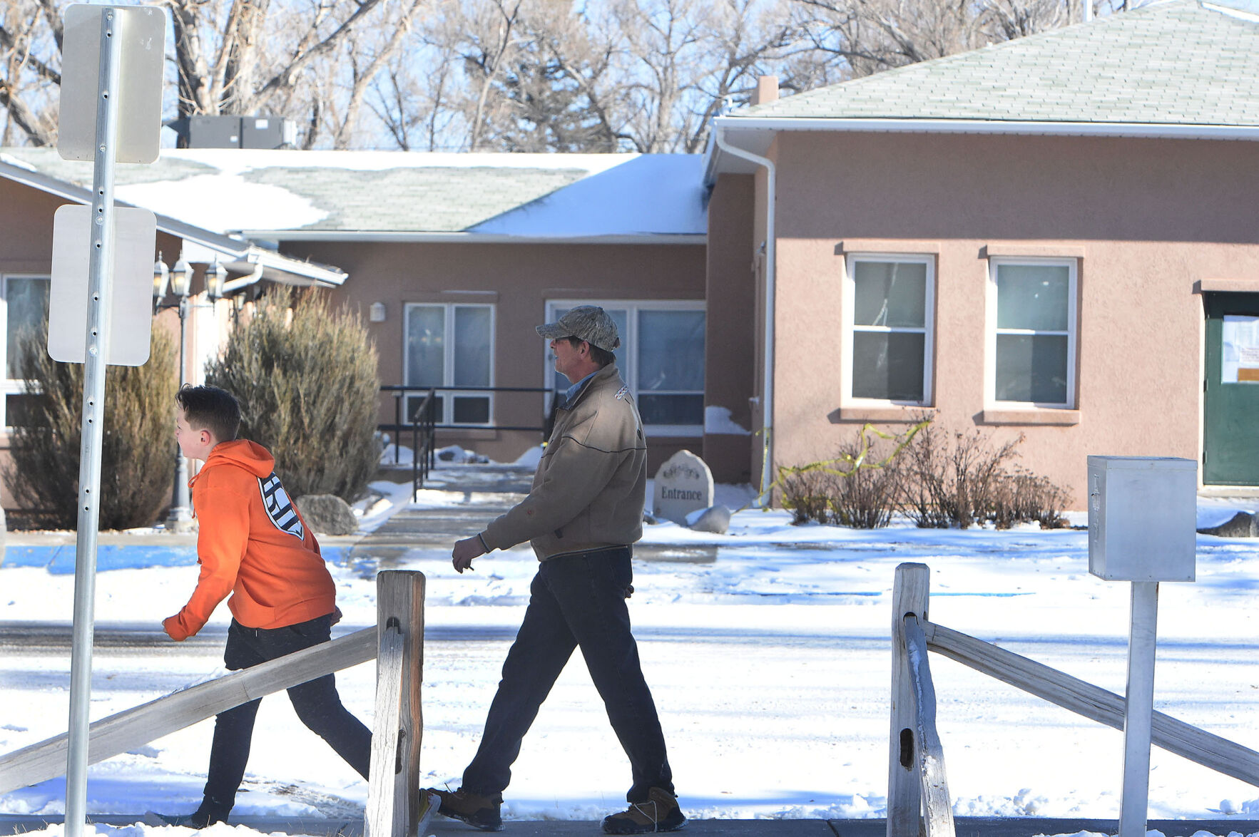The nursing home at the Good Samaritan Society in Simla in Elbert County is where the National Guardsman that caught the more contagious strain of the COVID virus was working. It is still unclear as to if this was where he caught it. A couple of passersby walk by the nursing home on the other side of the street in Simla on Wednesday, Dec. 30, 2020. Simla is a very small, quiet rural town that is about an hour east of Colorado Springs on Hwy. 24.(Photo by Jerilee Bennett, The Gazette) (JERILEE BENNETT)